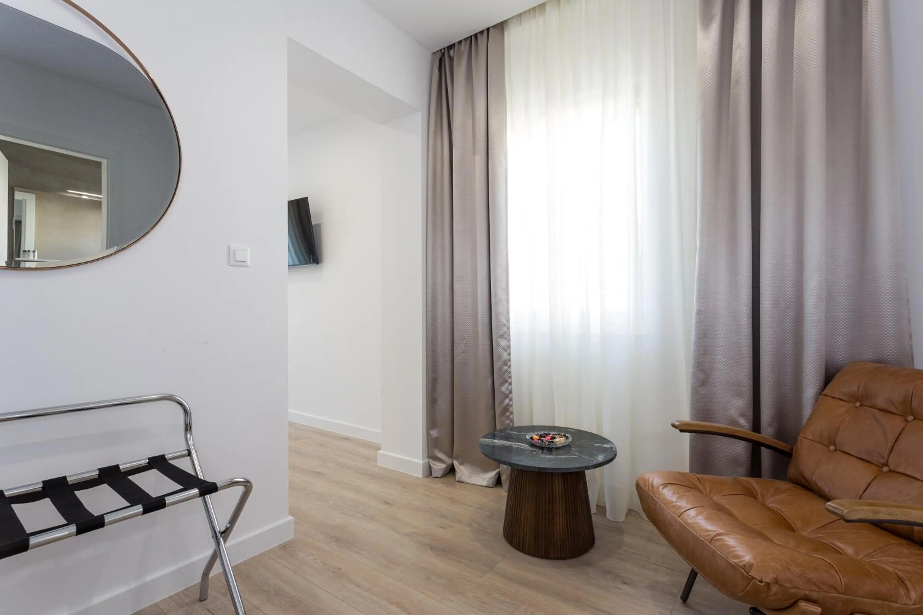 Seating area in Shine of Life Luxury Rooms