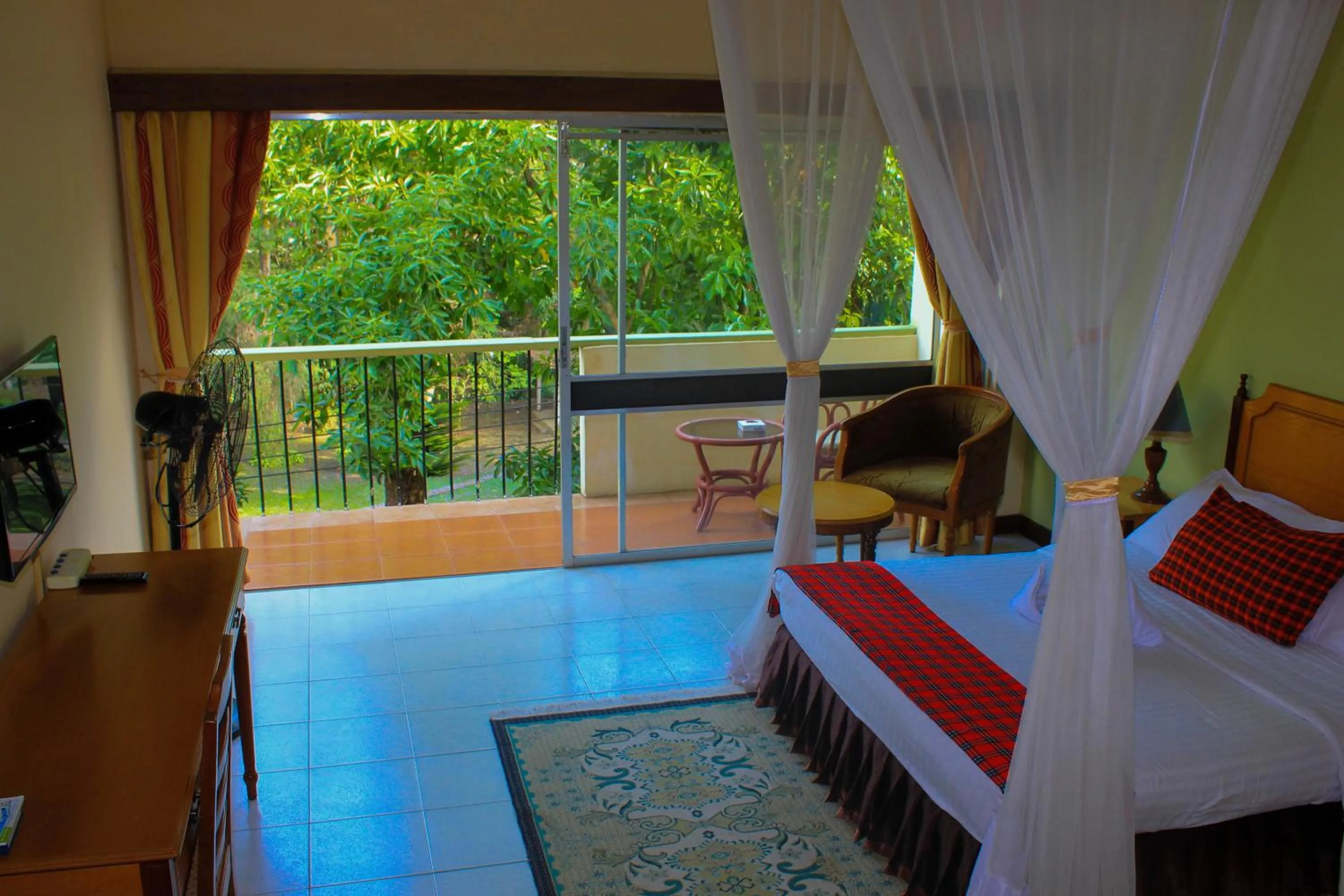 Garden view, Bed in Equator Hotel