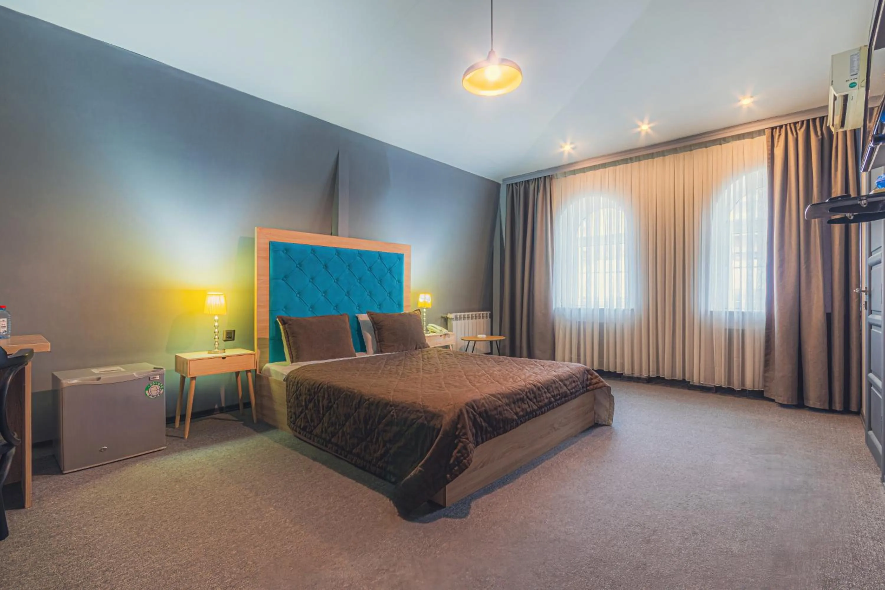 Bed in Maestro Hotel