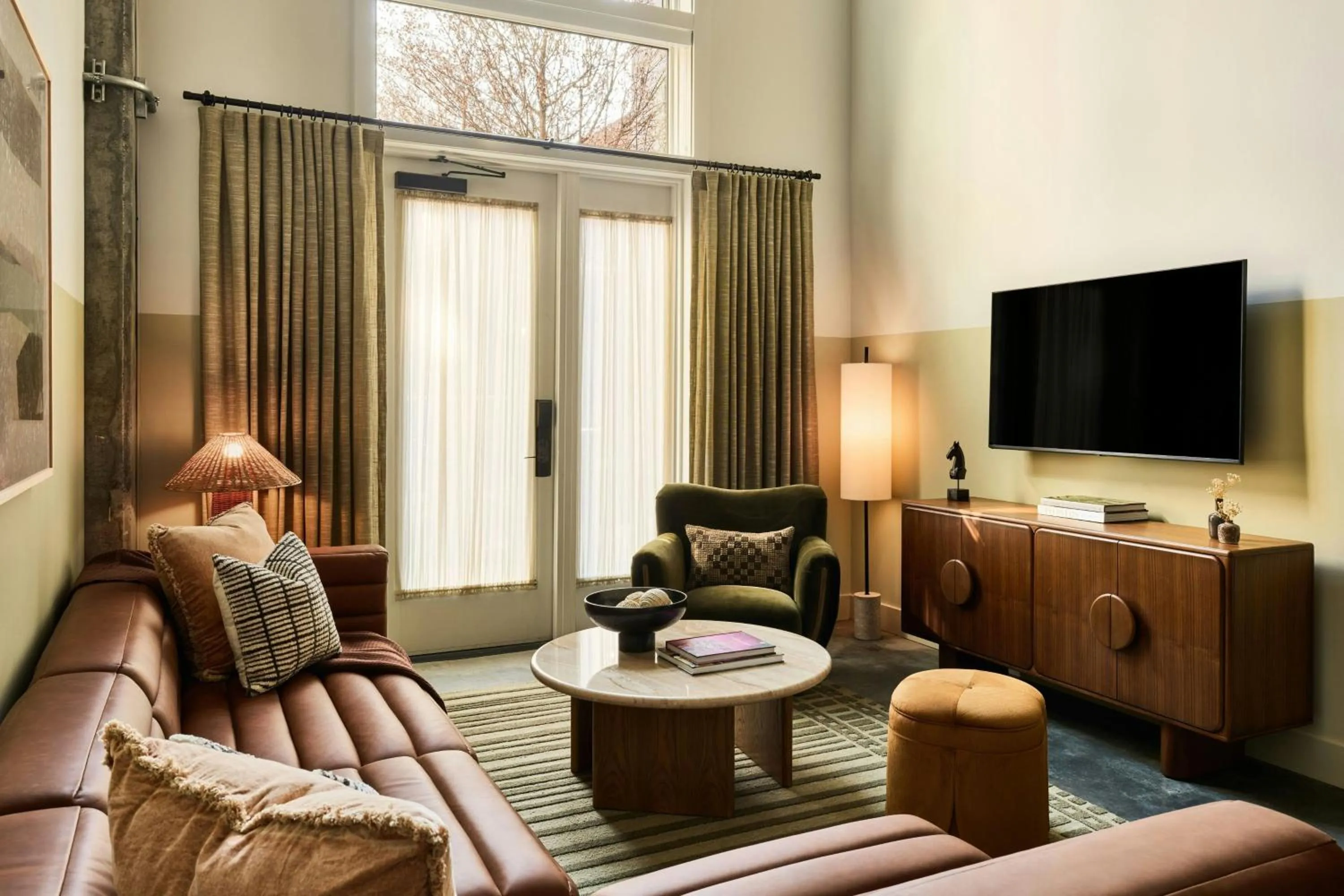 Living room in The Ann Savannah, Apartments by Marriott Bonvoy