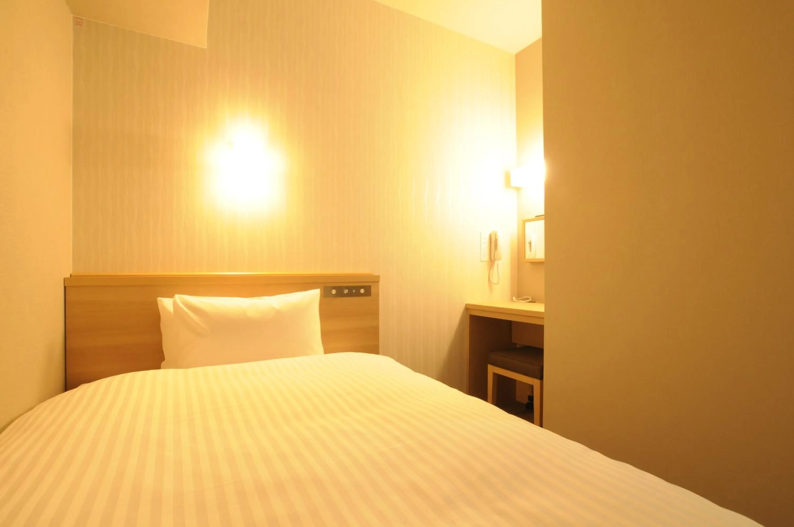 Bed in AB Hotel Tahara