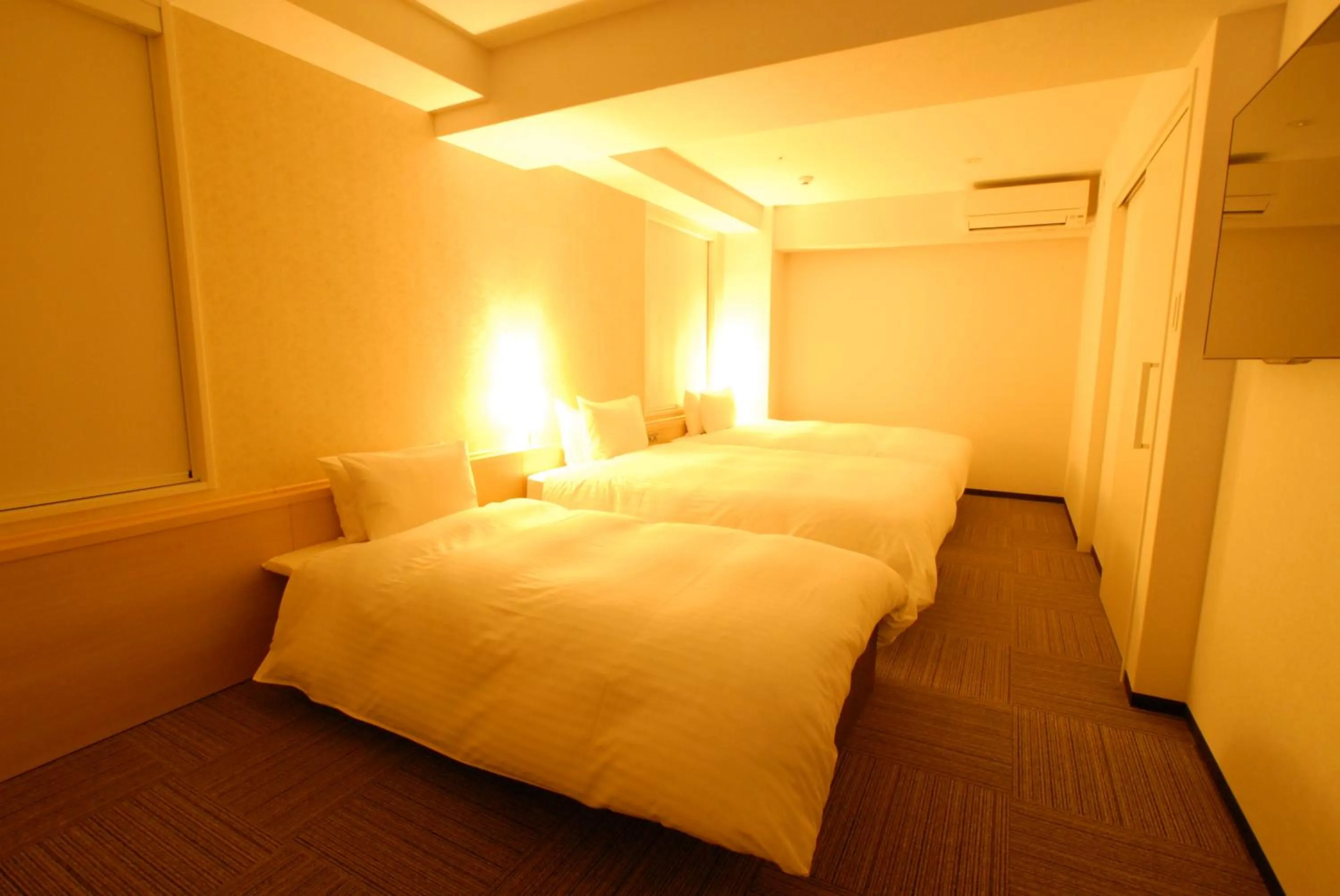 Bed in AB Hotel Tahara