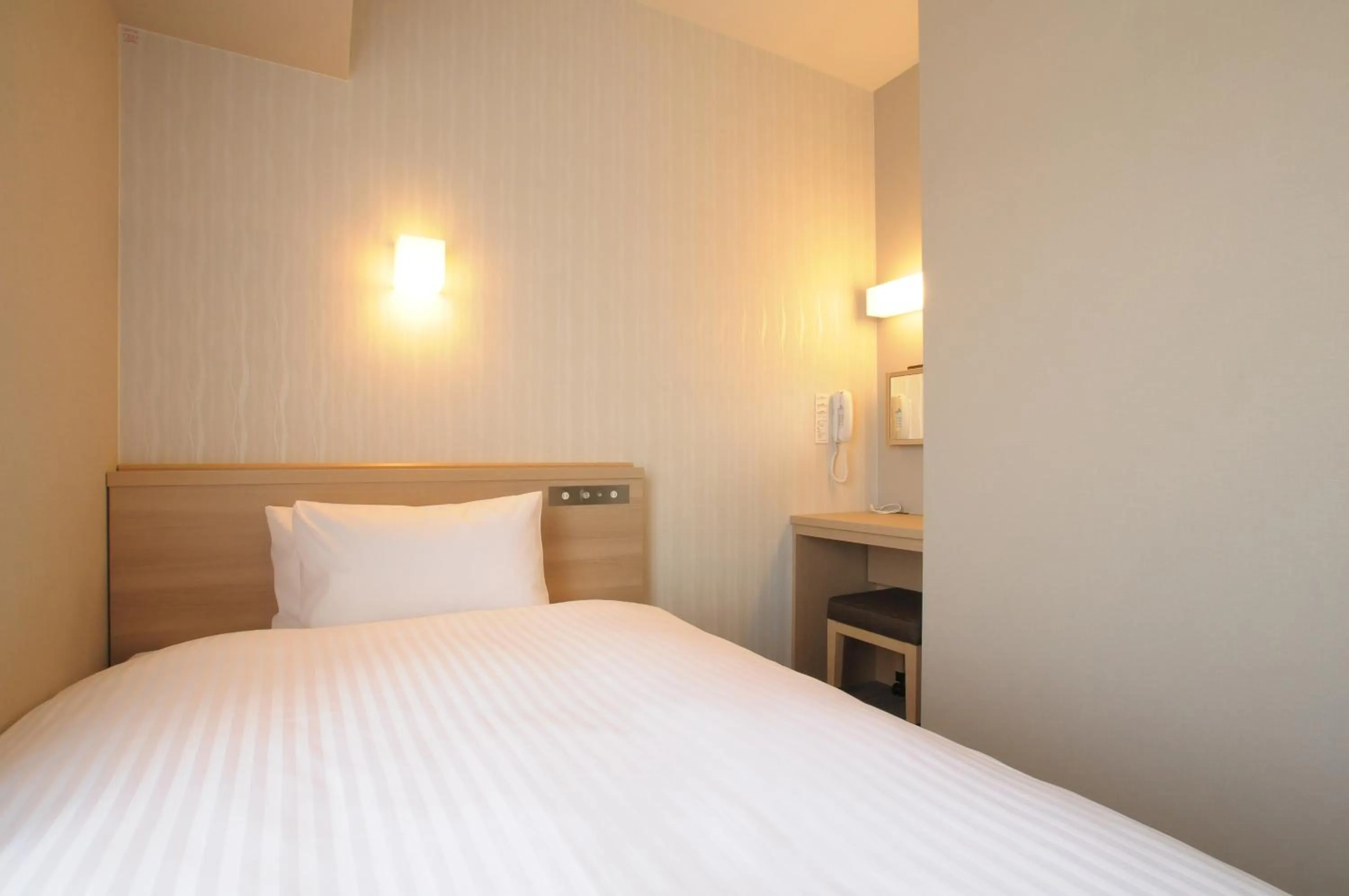 Bed in AB Hotel Tahara