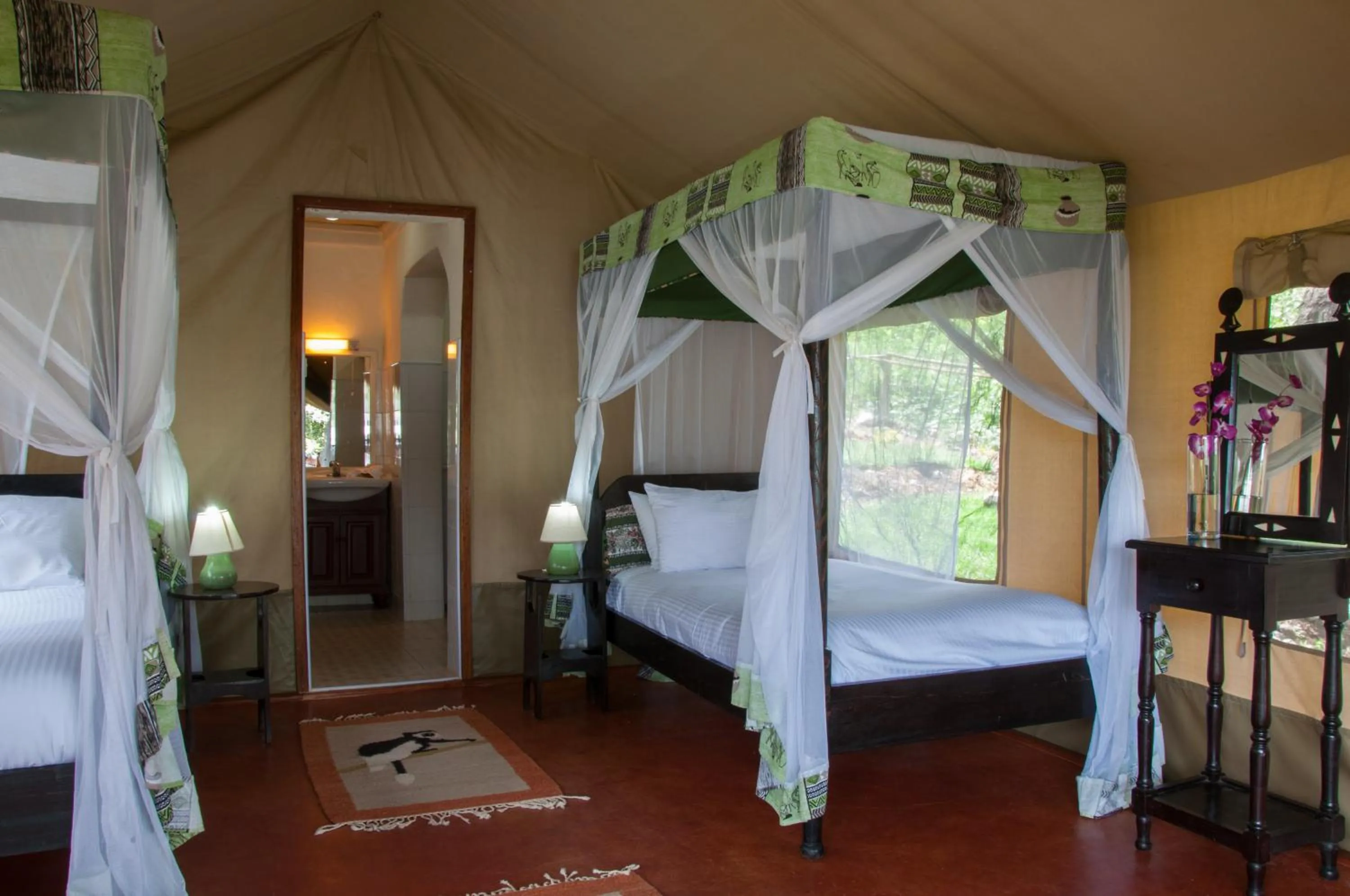 Bed in Crater Lake Tented Camp And Game Sanctuary