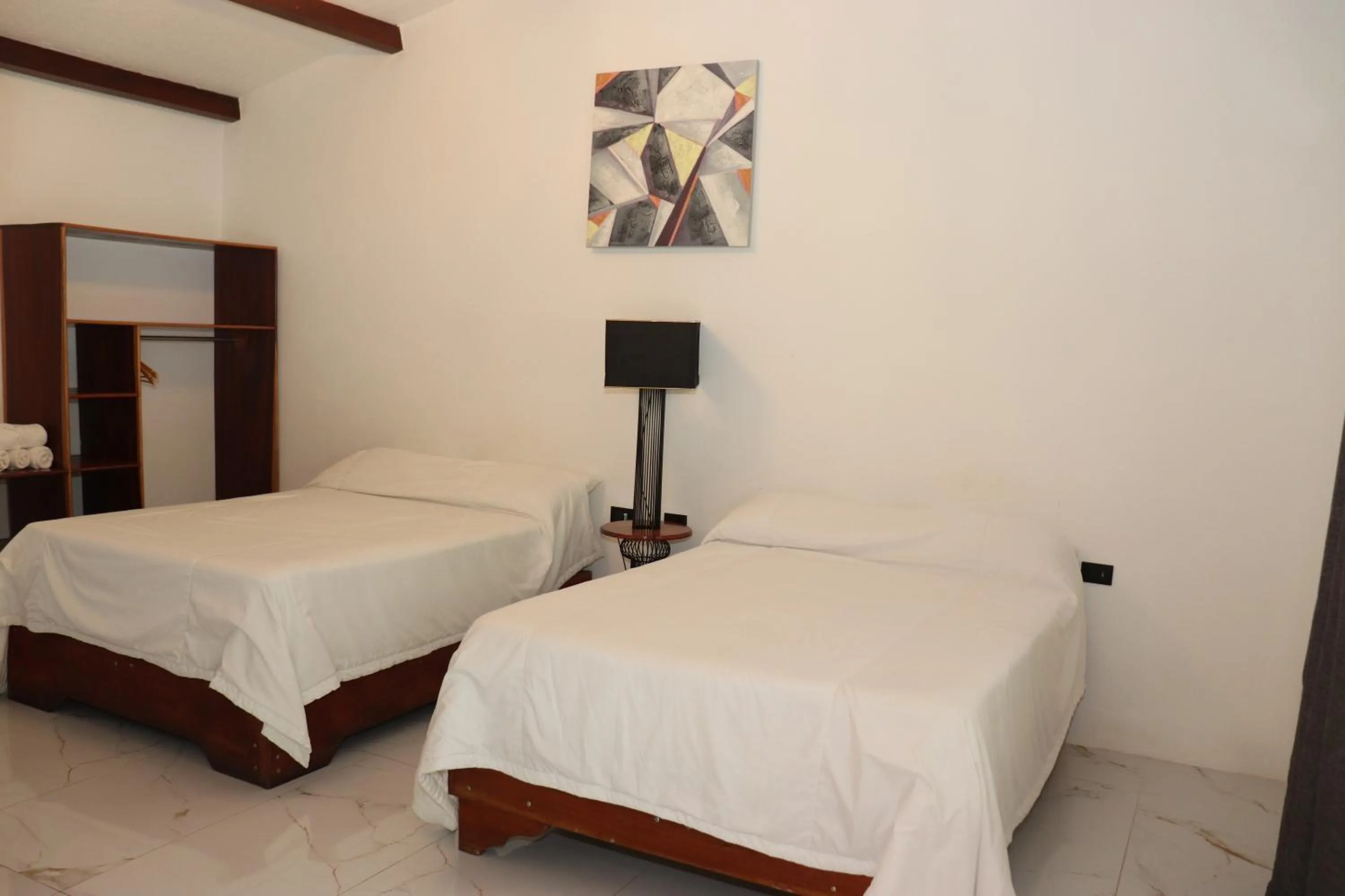 Photo of the whole room, Bed in Hotel Samoa del Sur