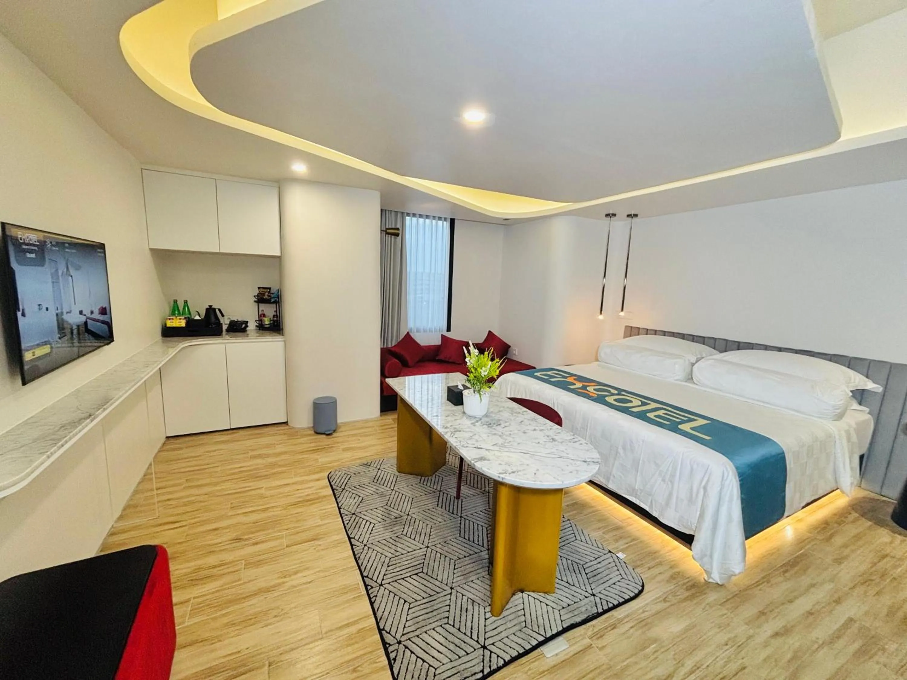 Photo of the whole room, Bed in EXCOTEL Design Hotel Surabaya