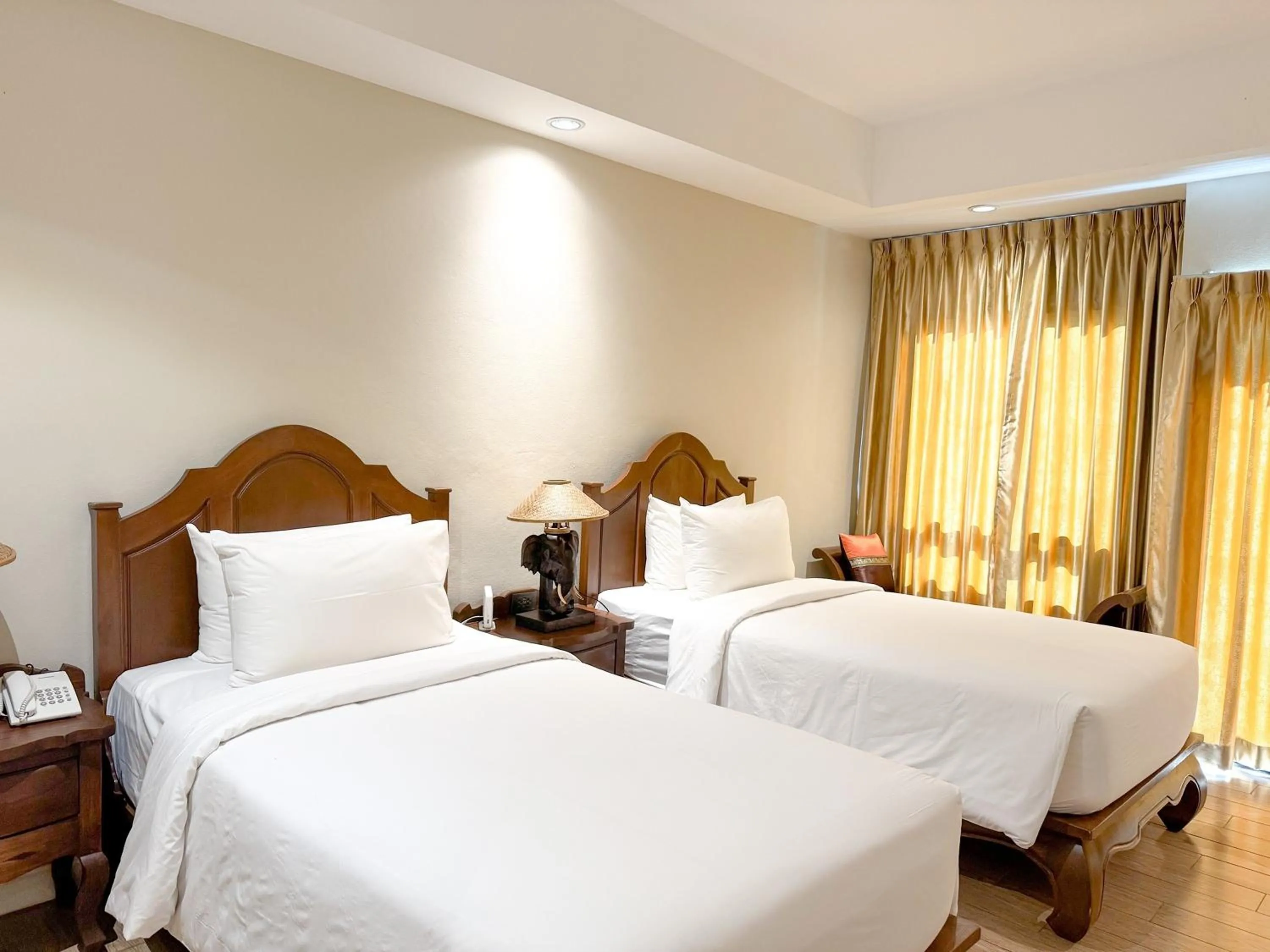 Bed in Kokhaburi Hotel