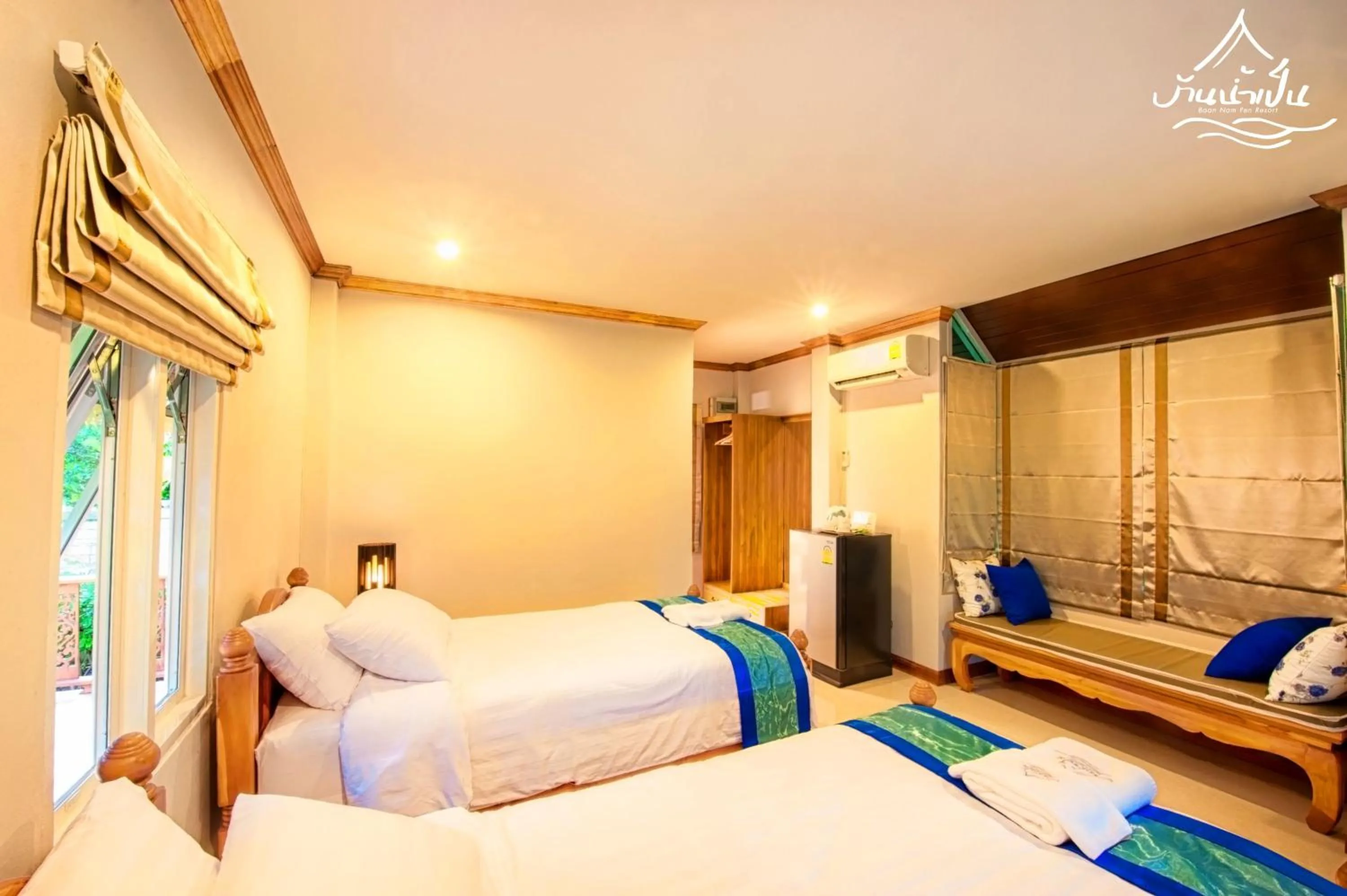 Bed in Baan Nam Pen Resort