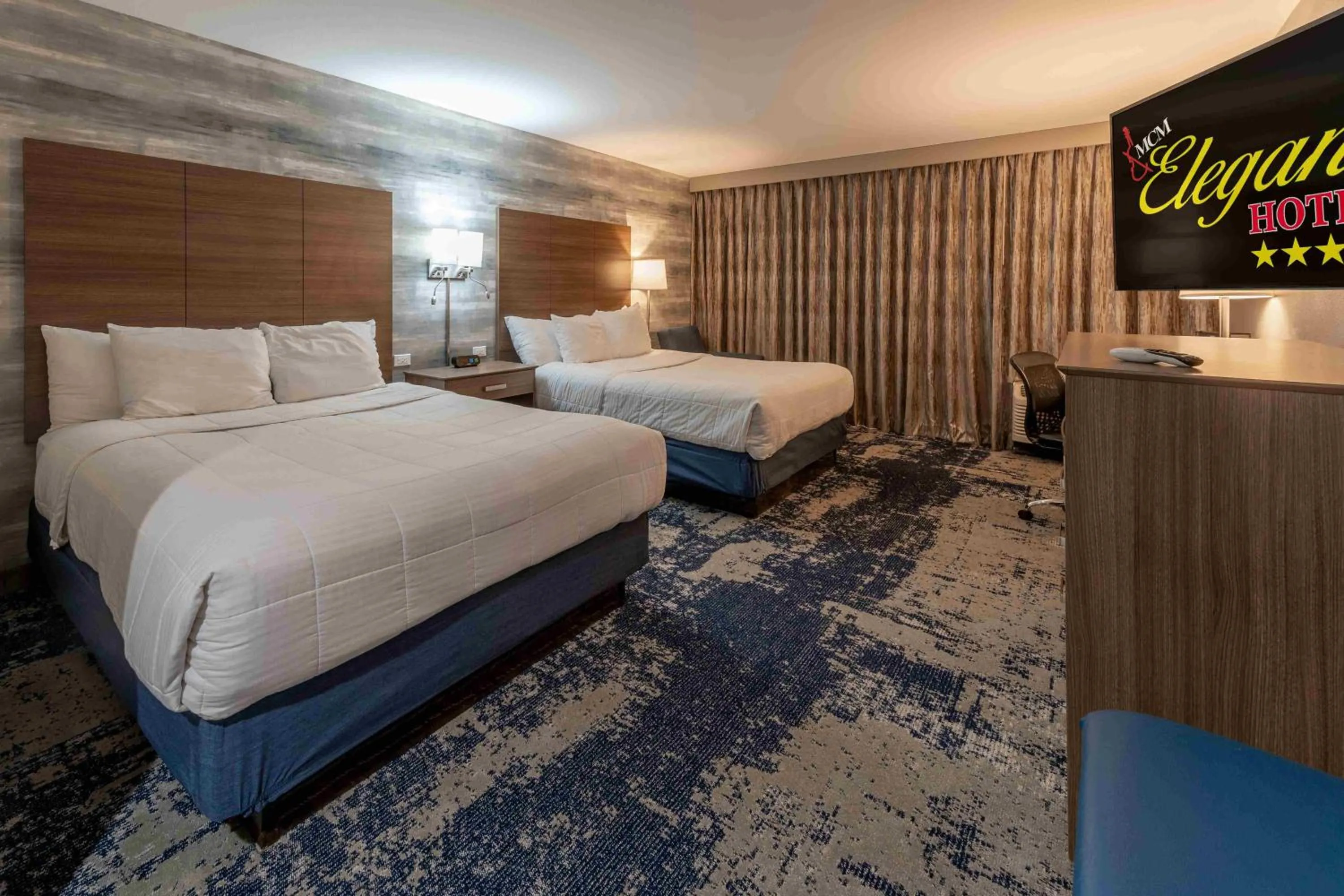 Photo of the whole room, Bed in MCM Elegante Hotel