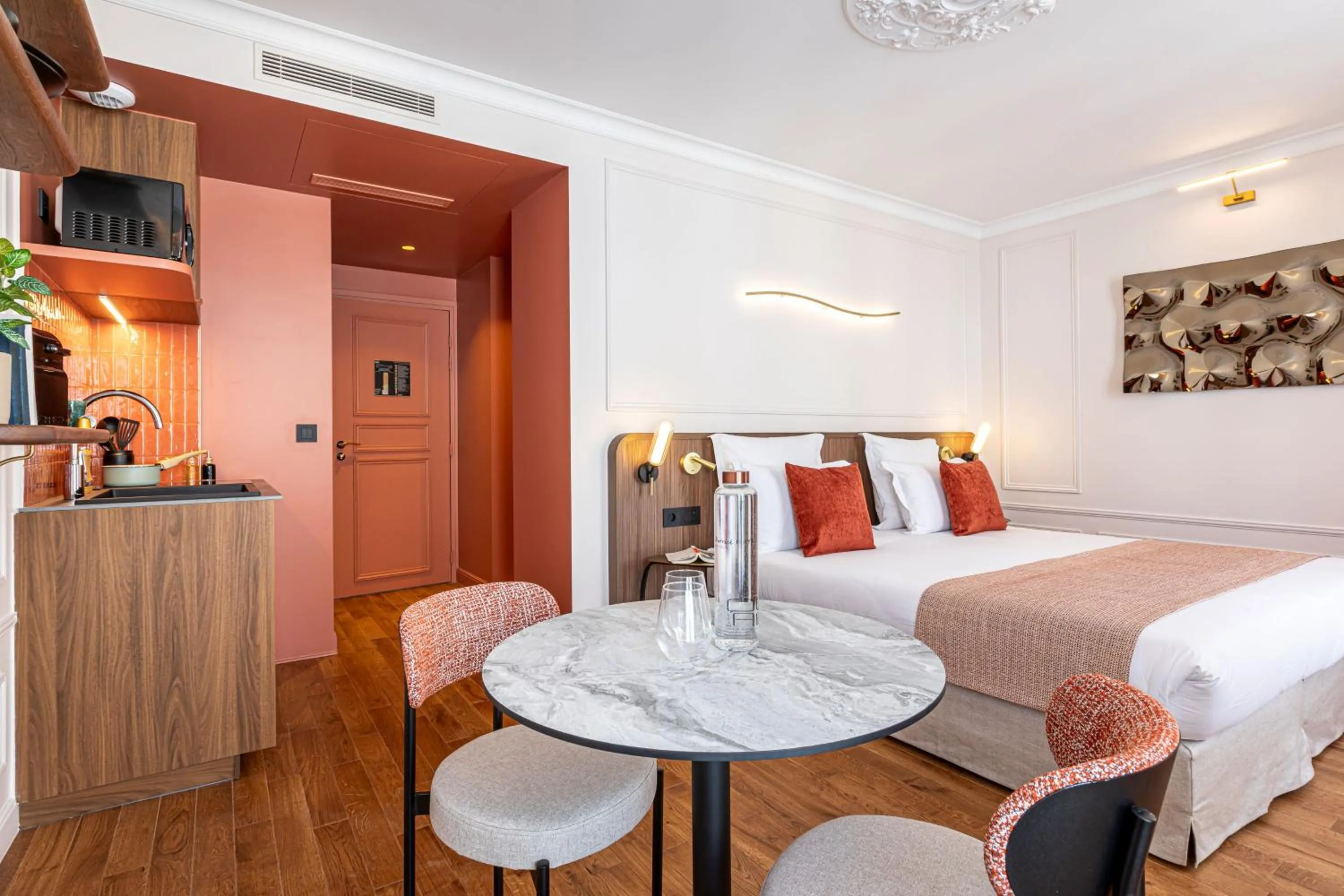 Kitchen or kitchenette, Bed in Villa SoPi Appart'Hotel by Patrick Hayat