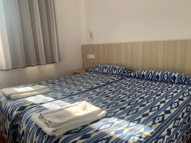 Bed in Casa Del Mar Hotel & Apartaments