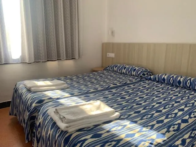 Bed in Casa Del Mar Hotel & Apartaments