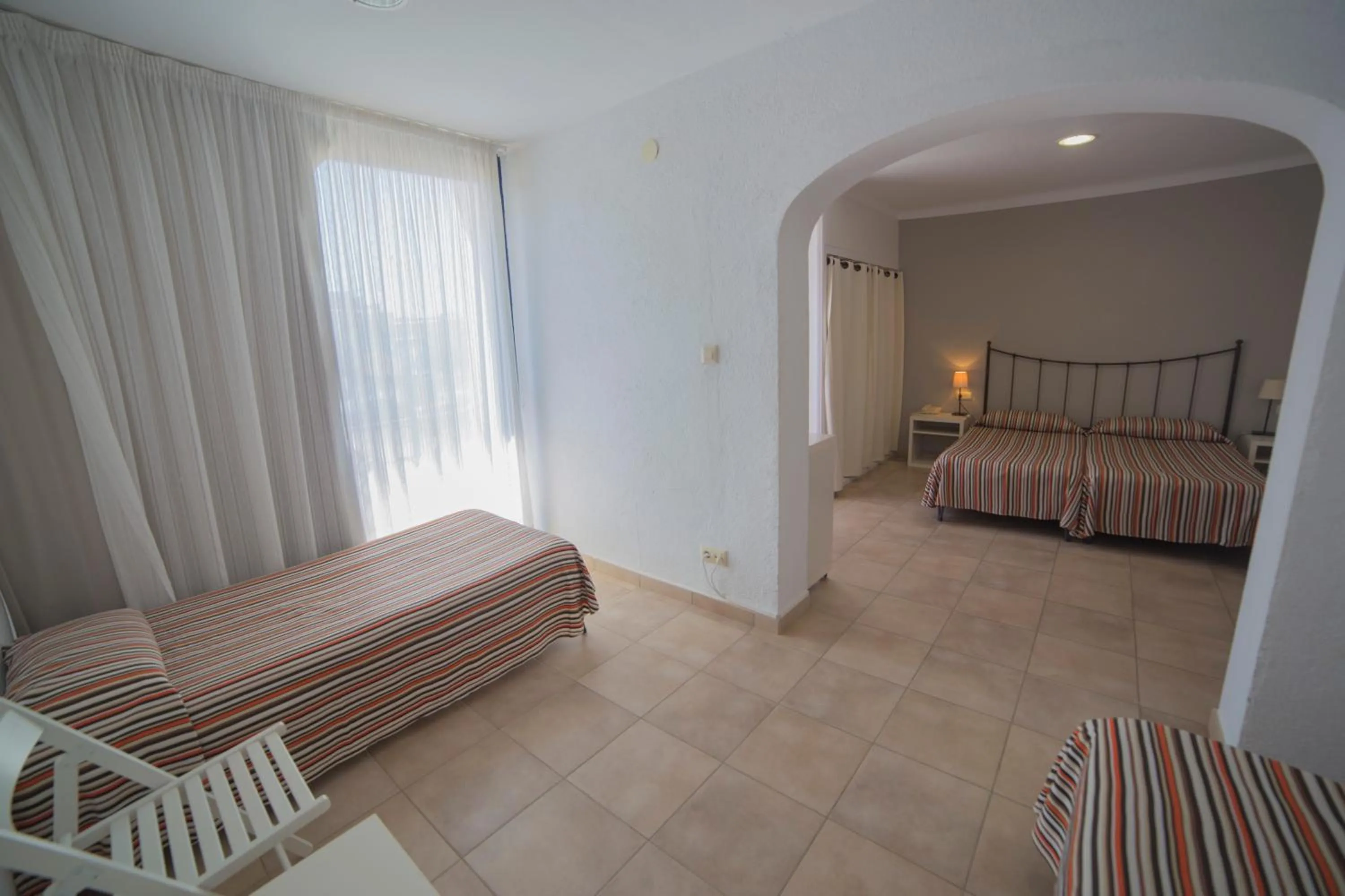 Bed in Casa Del Mar Hotel & Apartaments