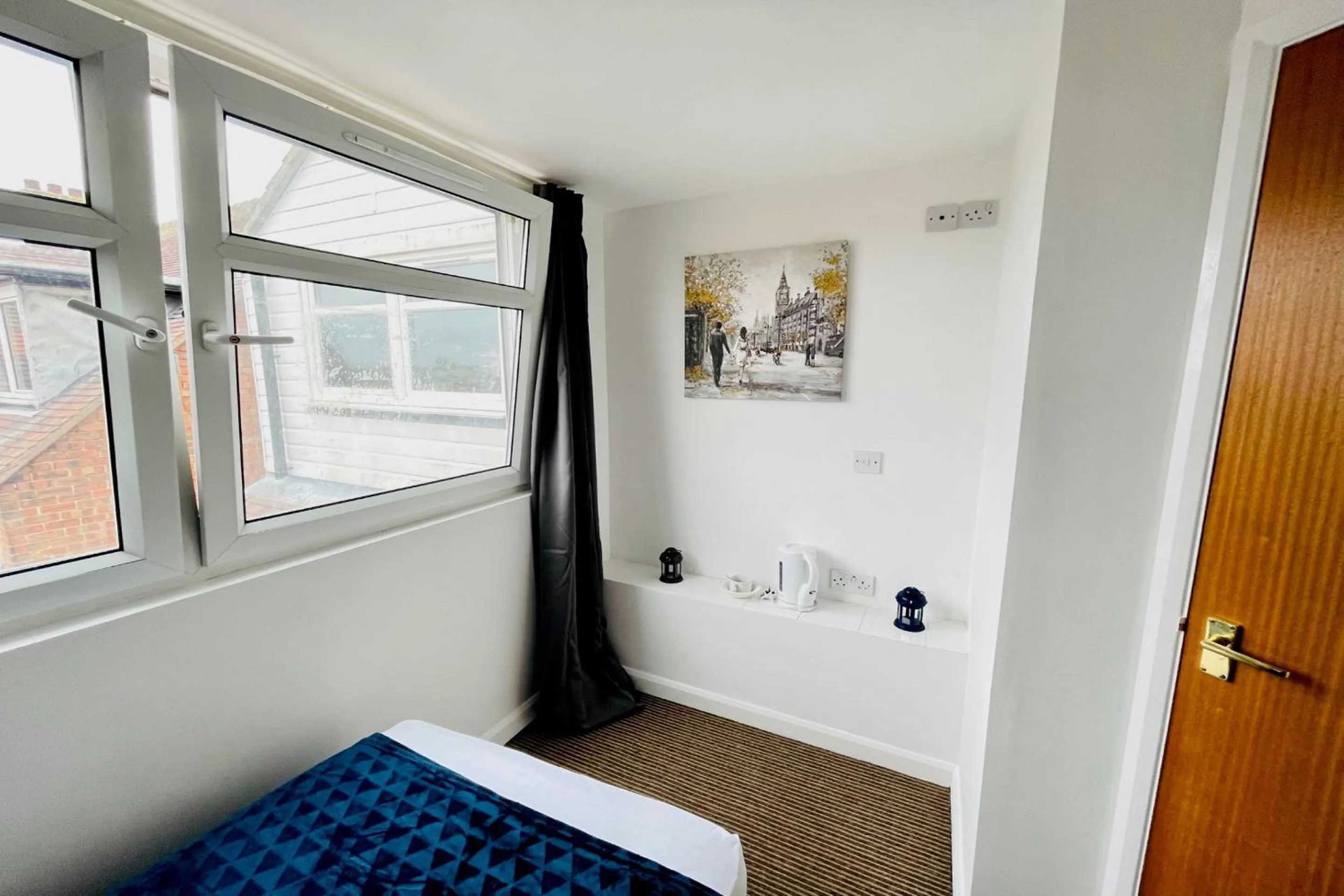 Bedroom in OYO The Sun Hotel