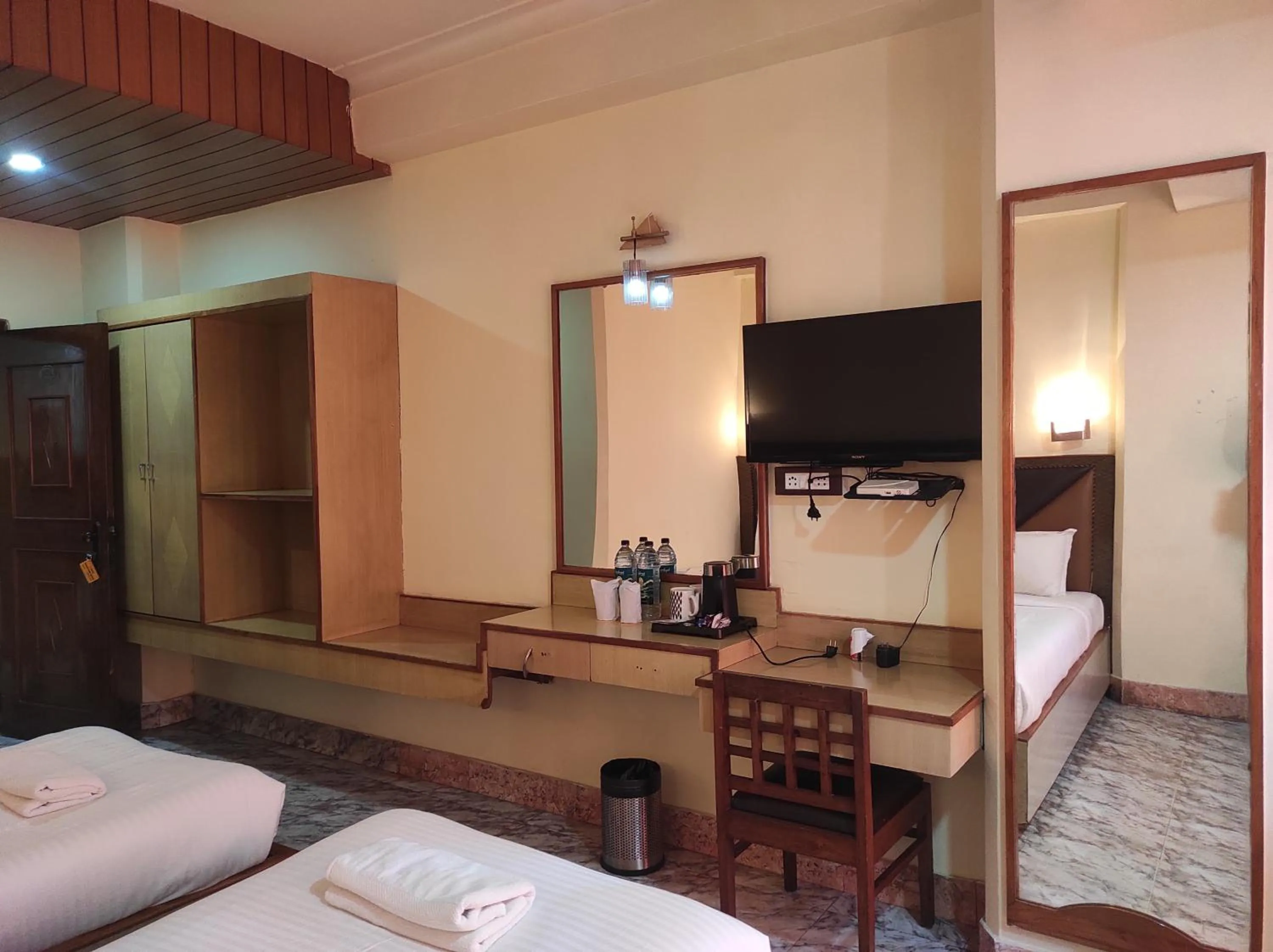 Bed in Hotel Ambarish Grand Residency