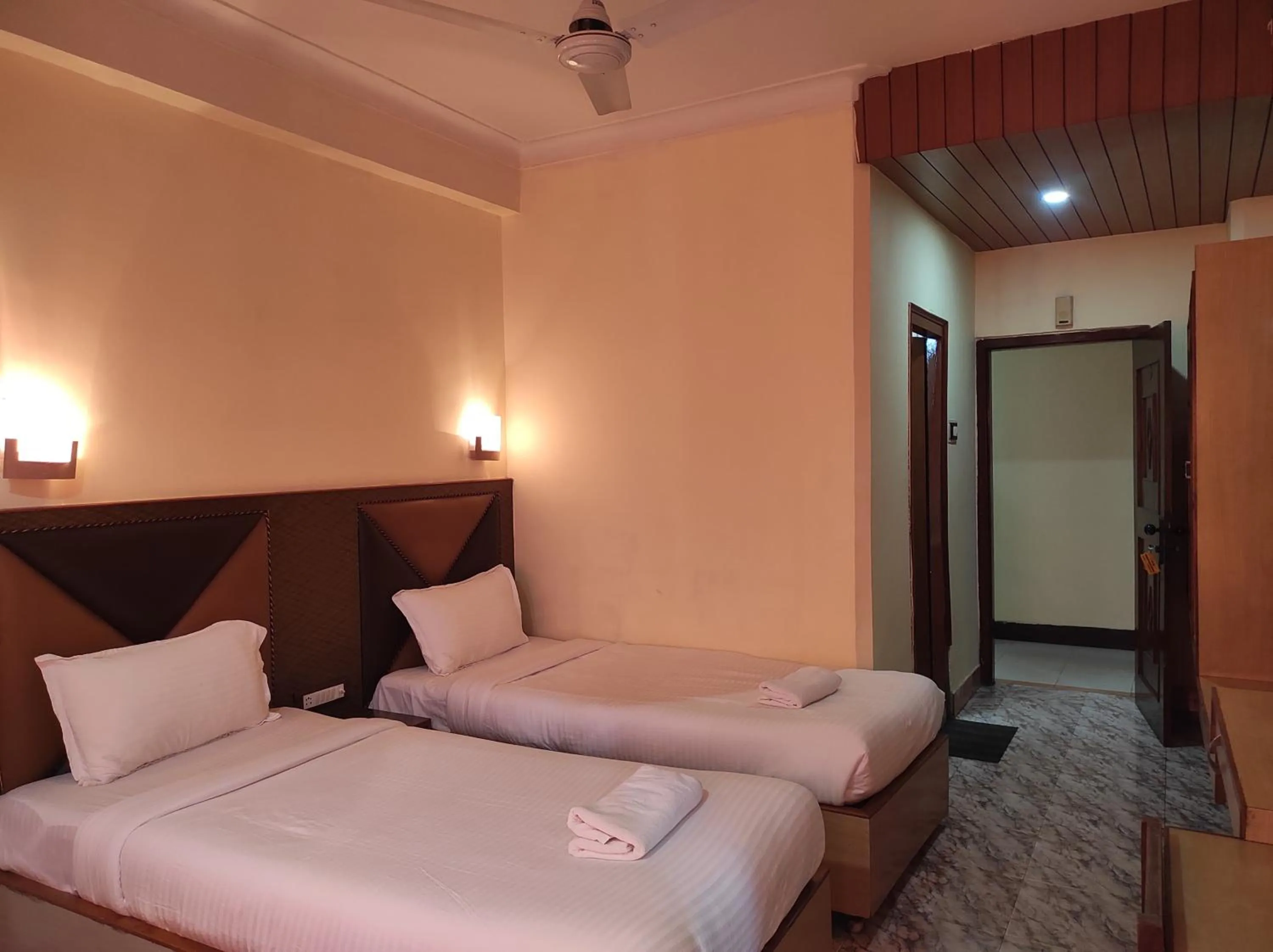 Bed in Hotel Ambarish Grand Residency