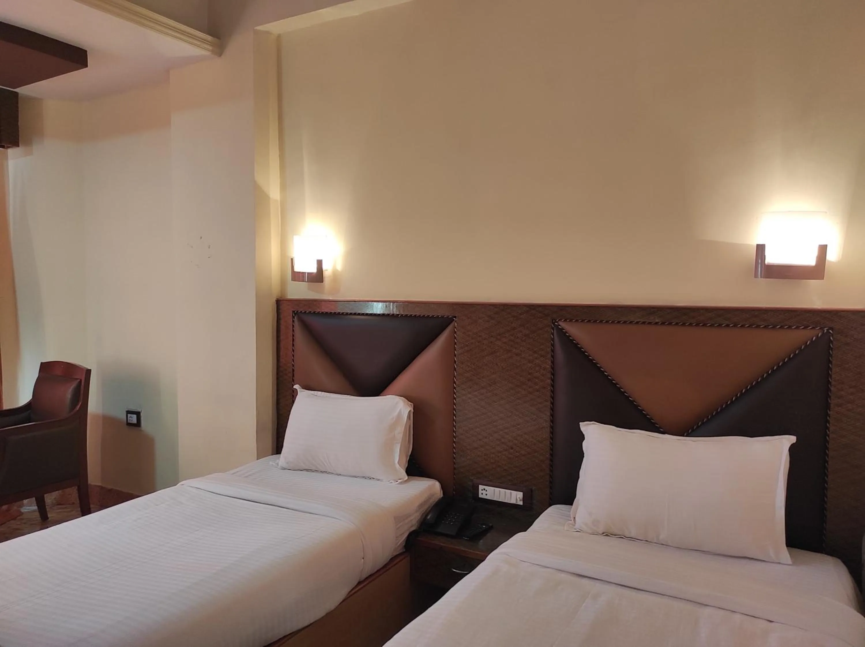 Bed in Hotel Ambarish Grand Residency