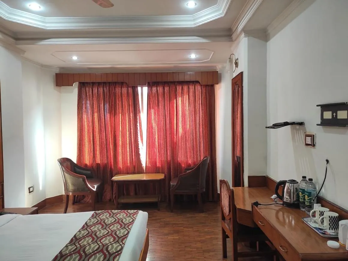 Bedroom in Hotel Ambarish Grand Residency