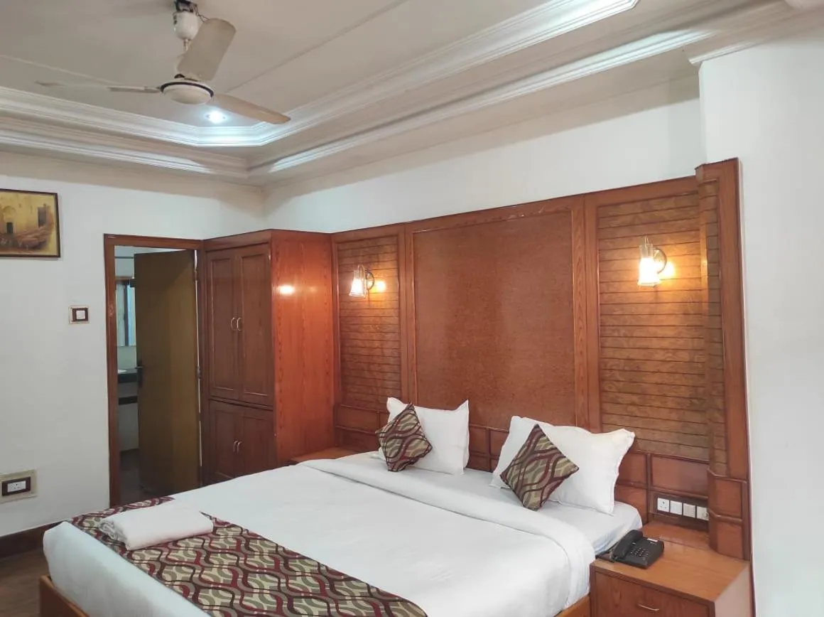 Bedroom in Hotel Ambarish Grand Residency