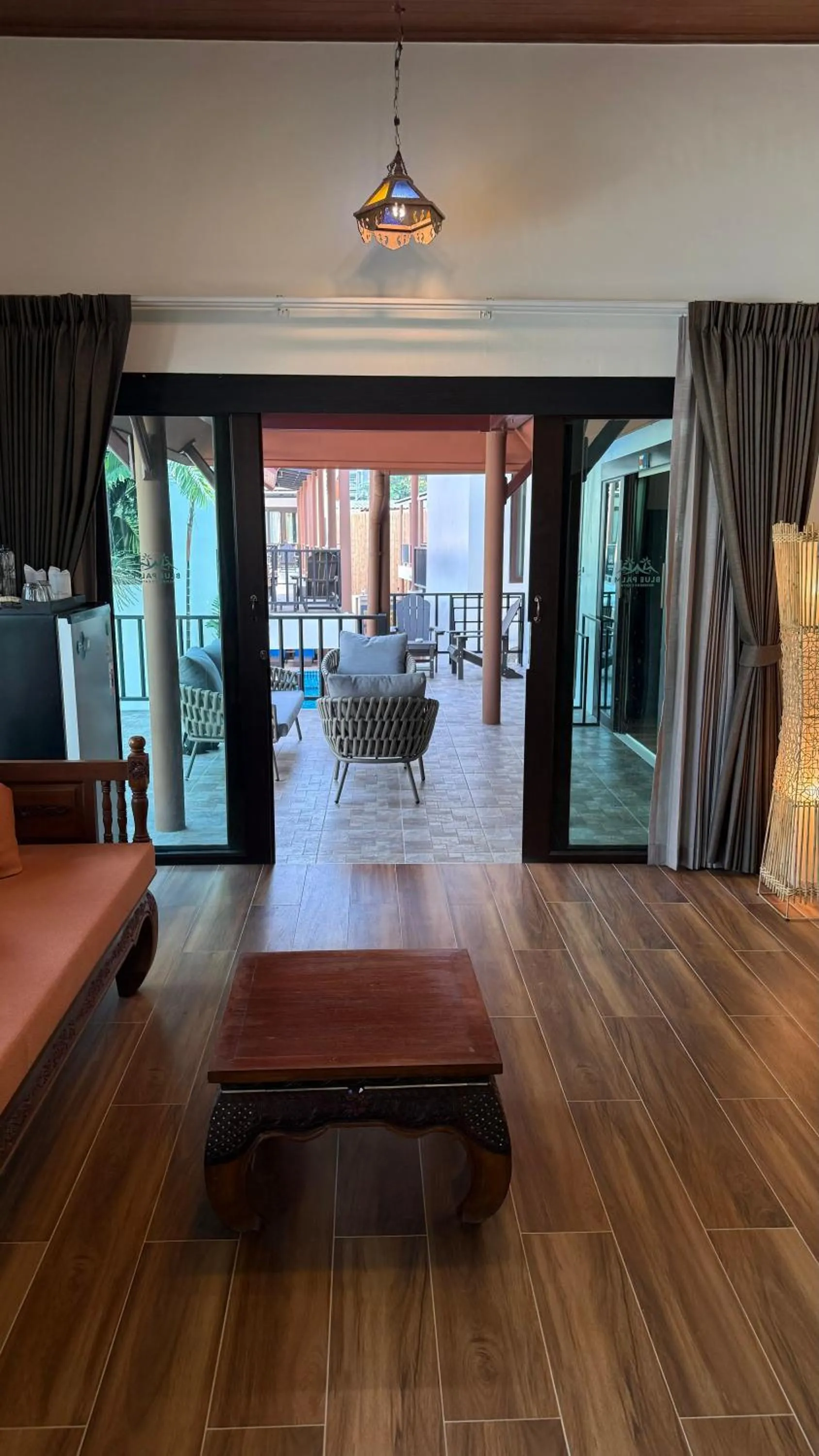 Seating area in Blue Palm Residence Kata