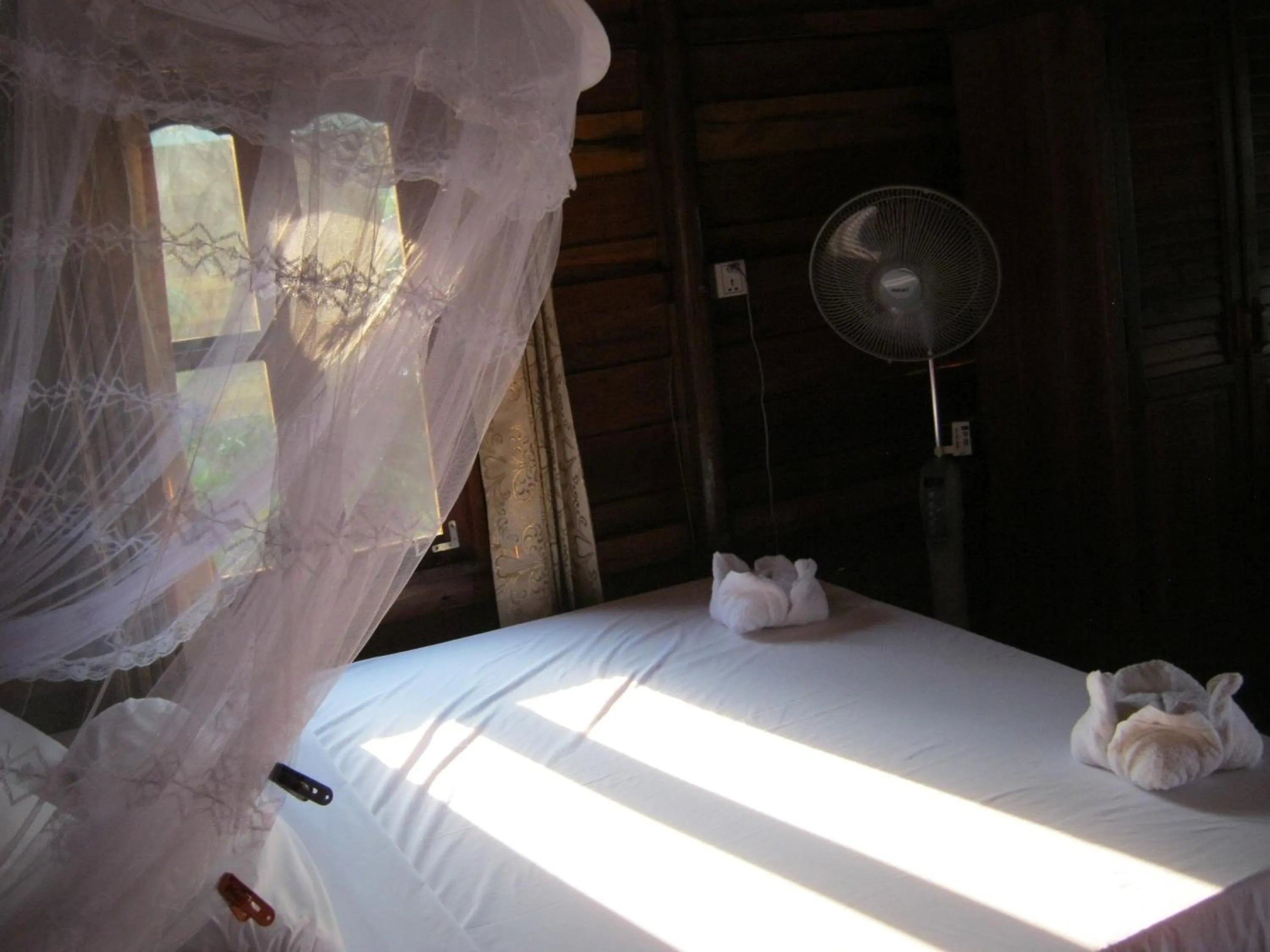 Bed in Coconutbeach Bungalows