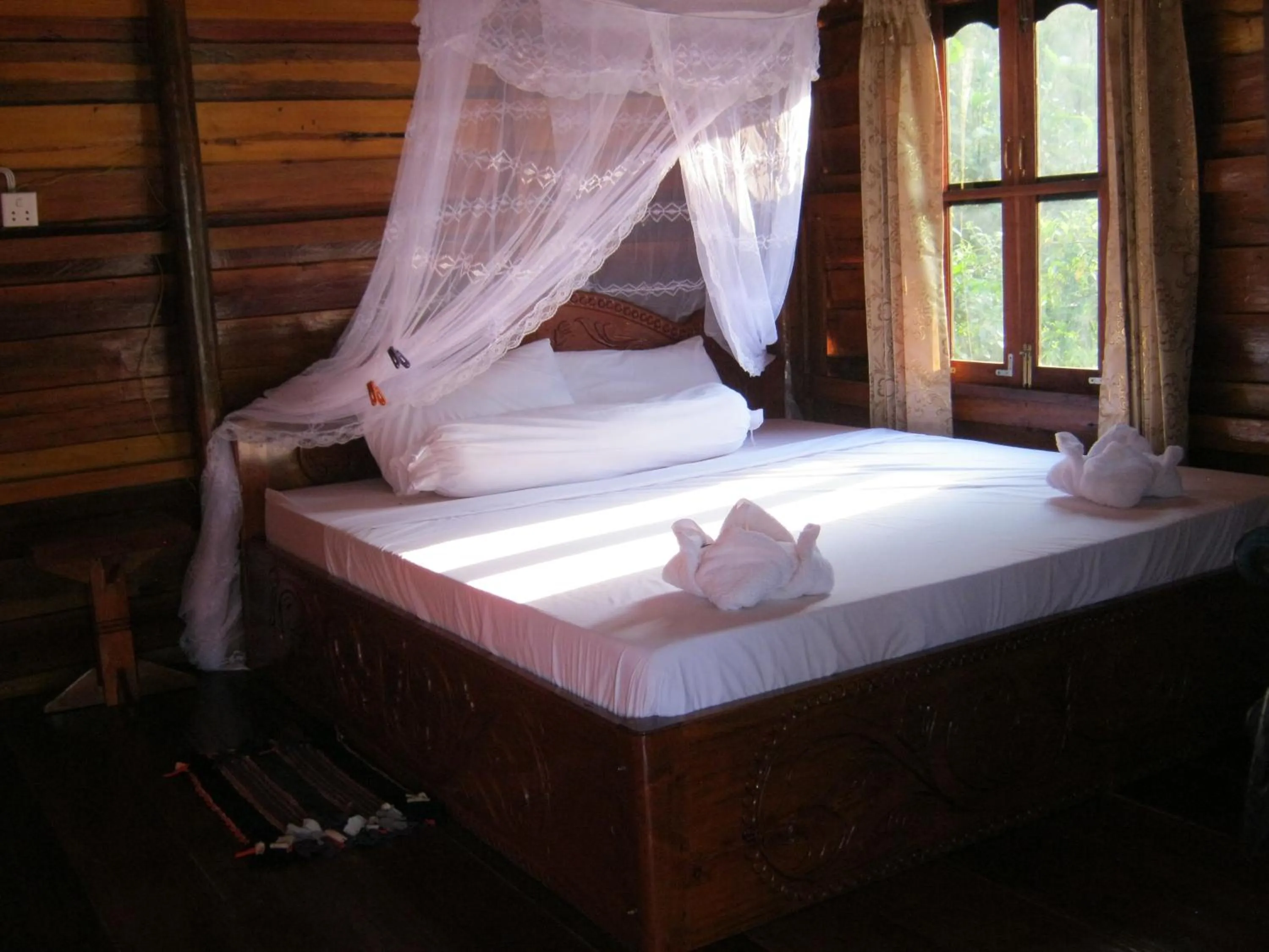 Bed in Coconutbeach Bungalows