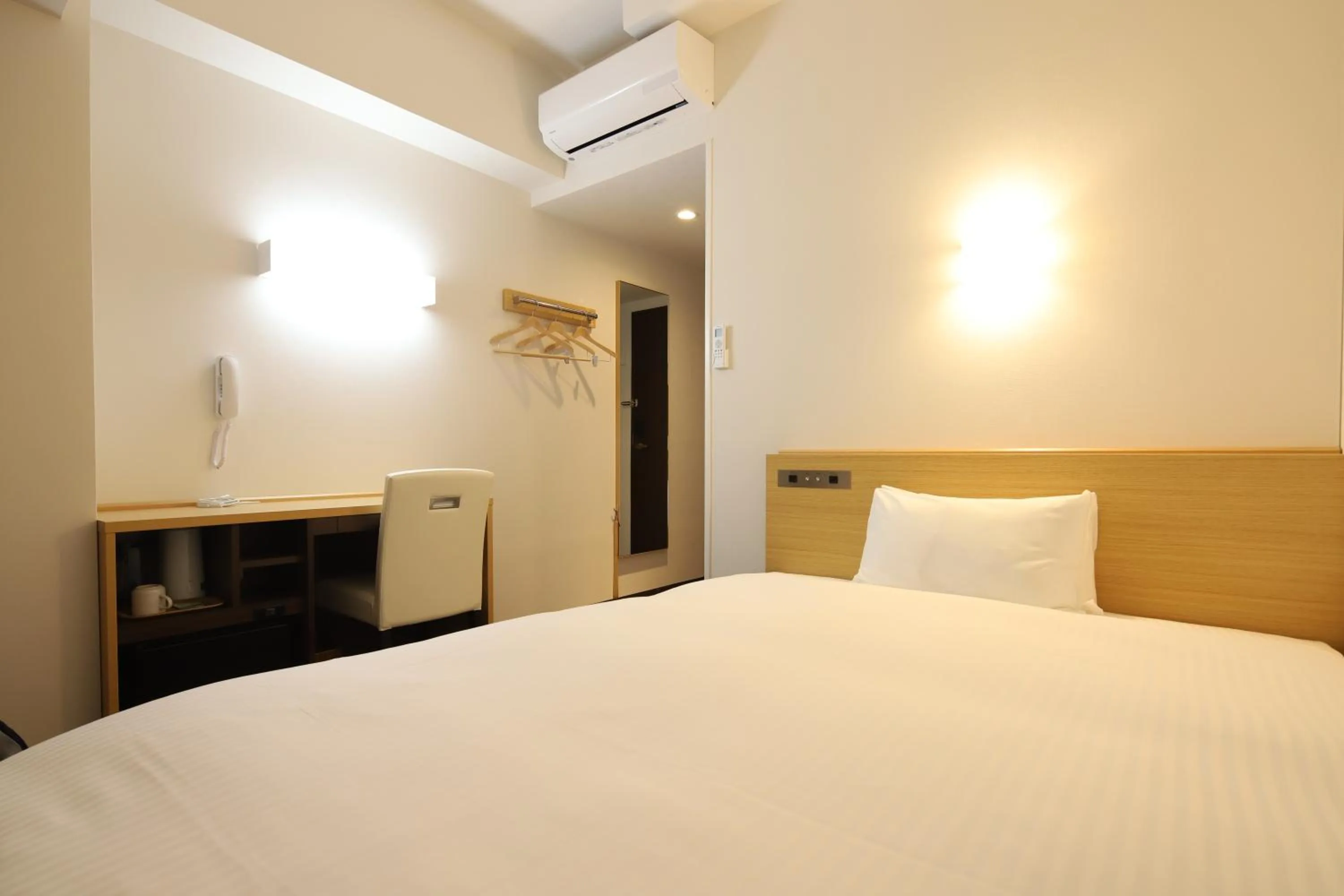 Bed in AB Hotel Kani