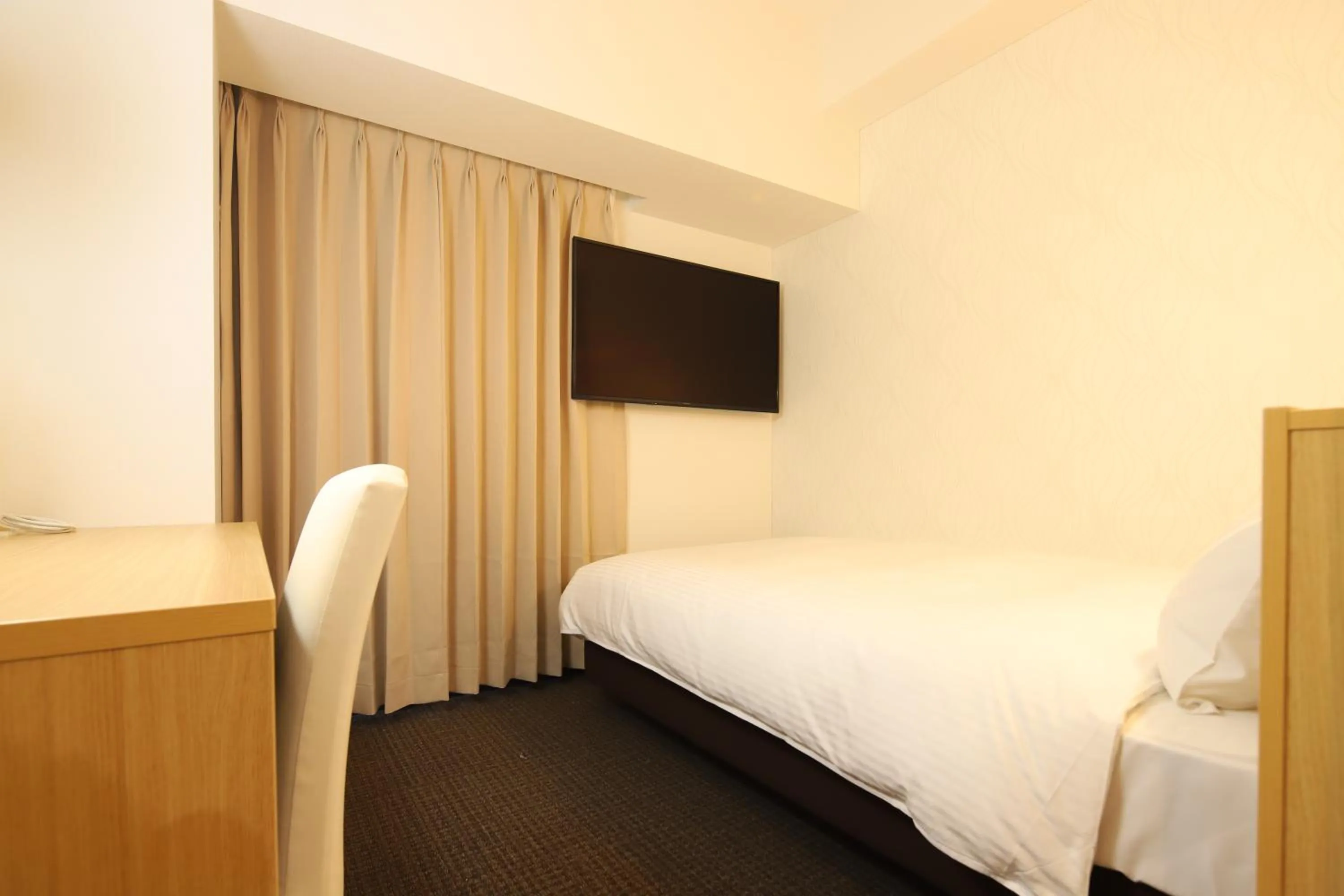 Bed in AB Hotel Kani