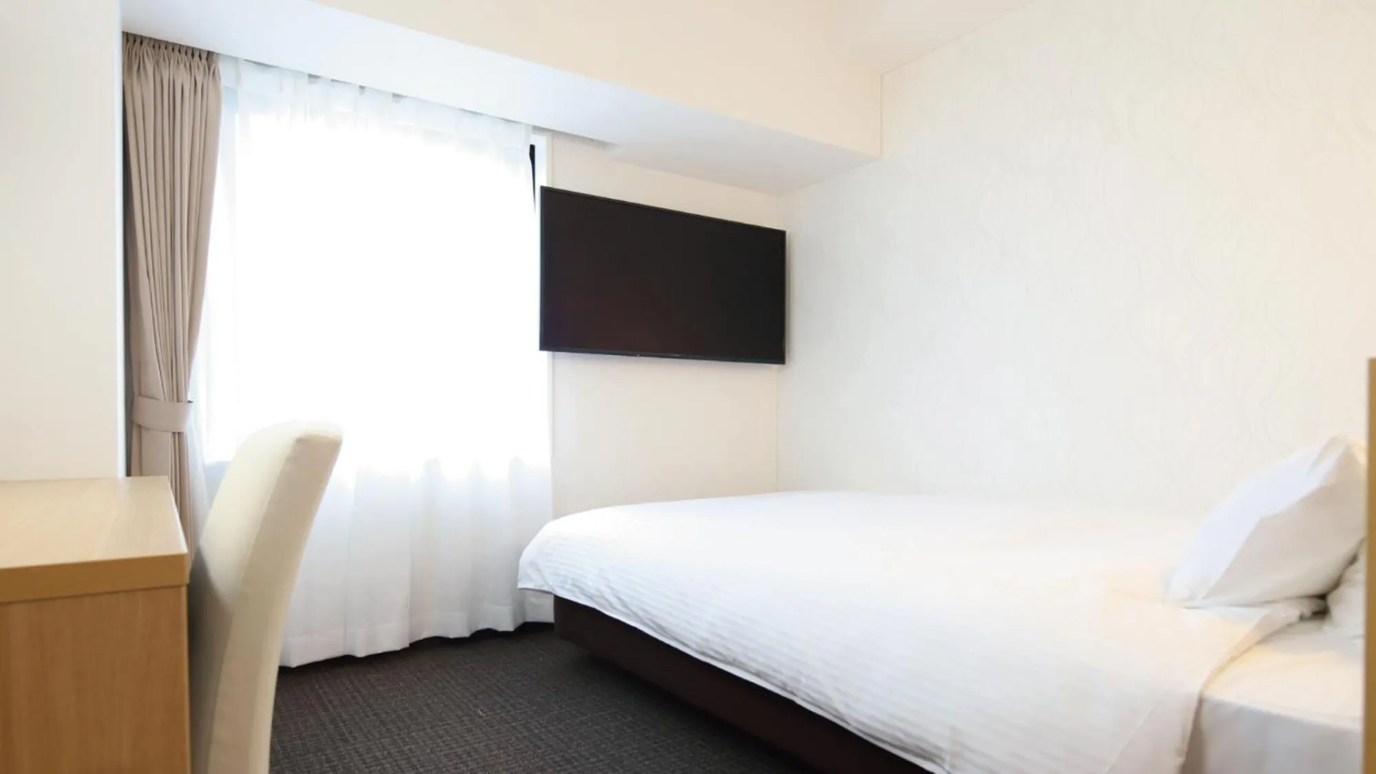 Bed in AB Hotel Kani