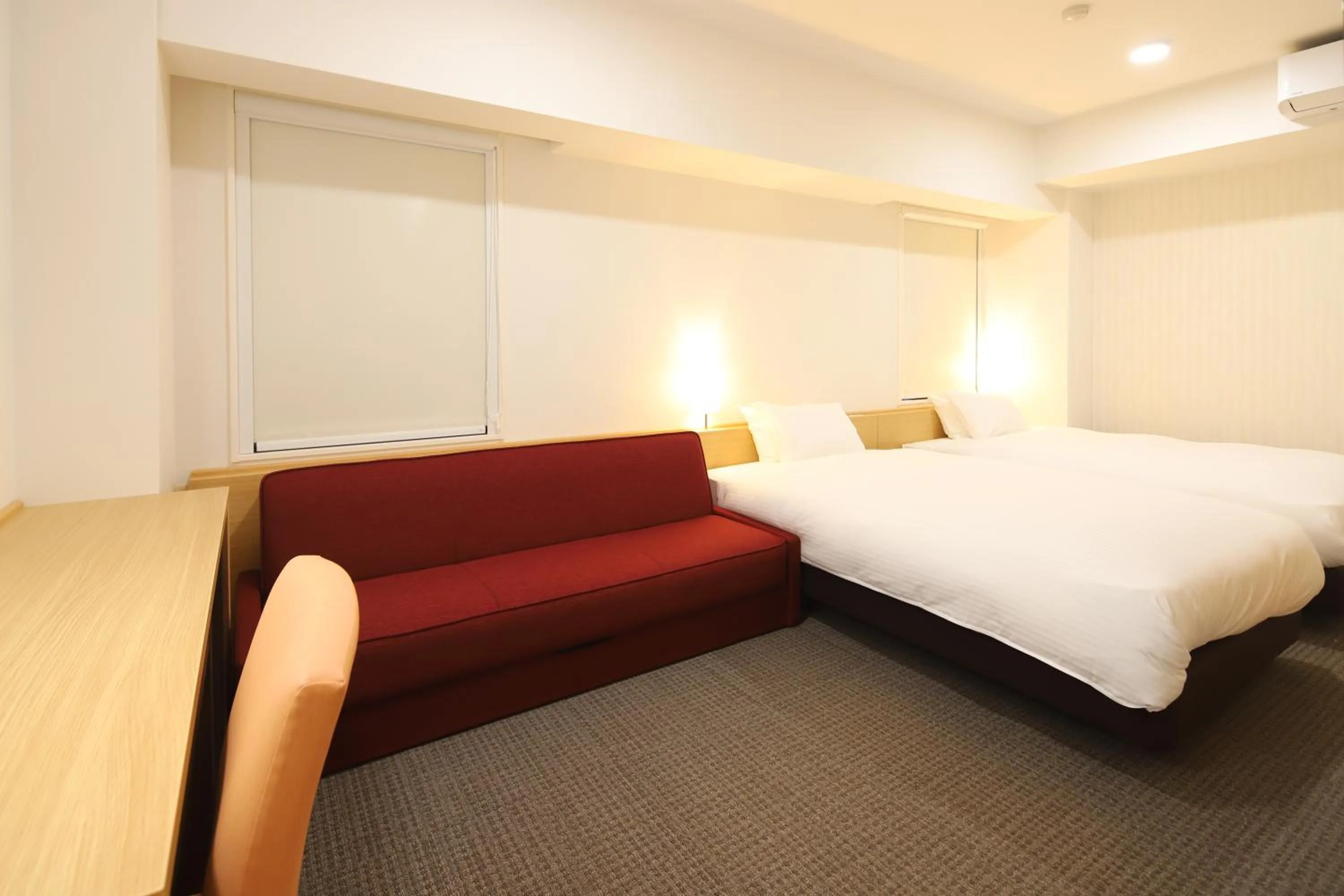 Bed in AB Hotel Kani