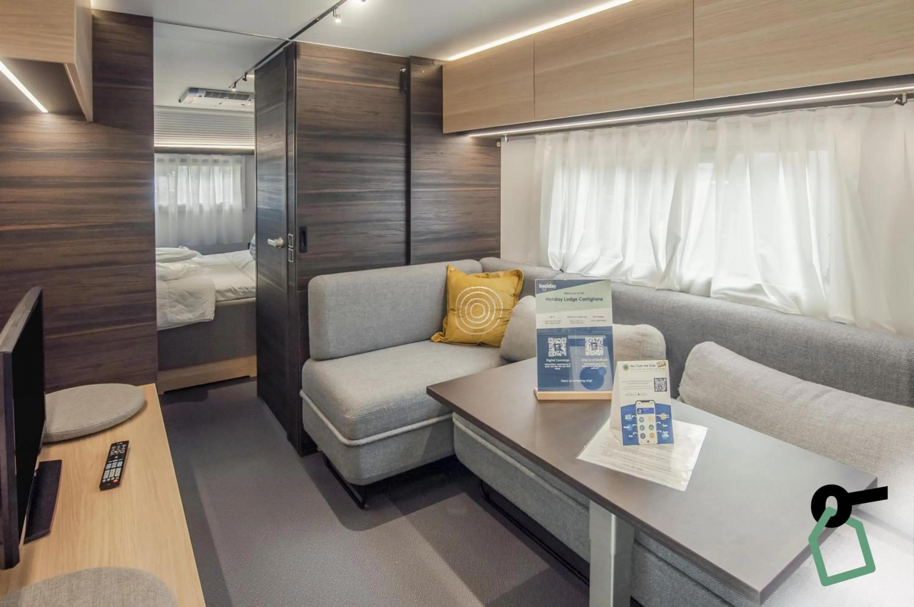 Living room, Bed in HOTIDAY Lodge Castiglione