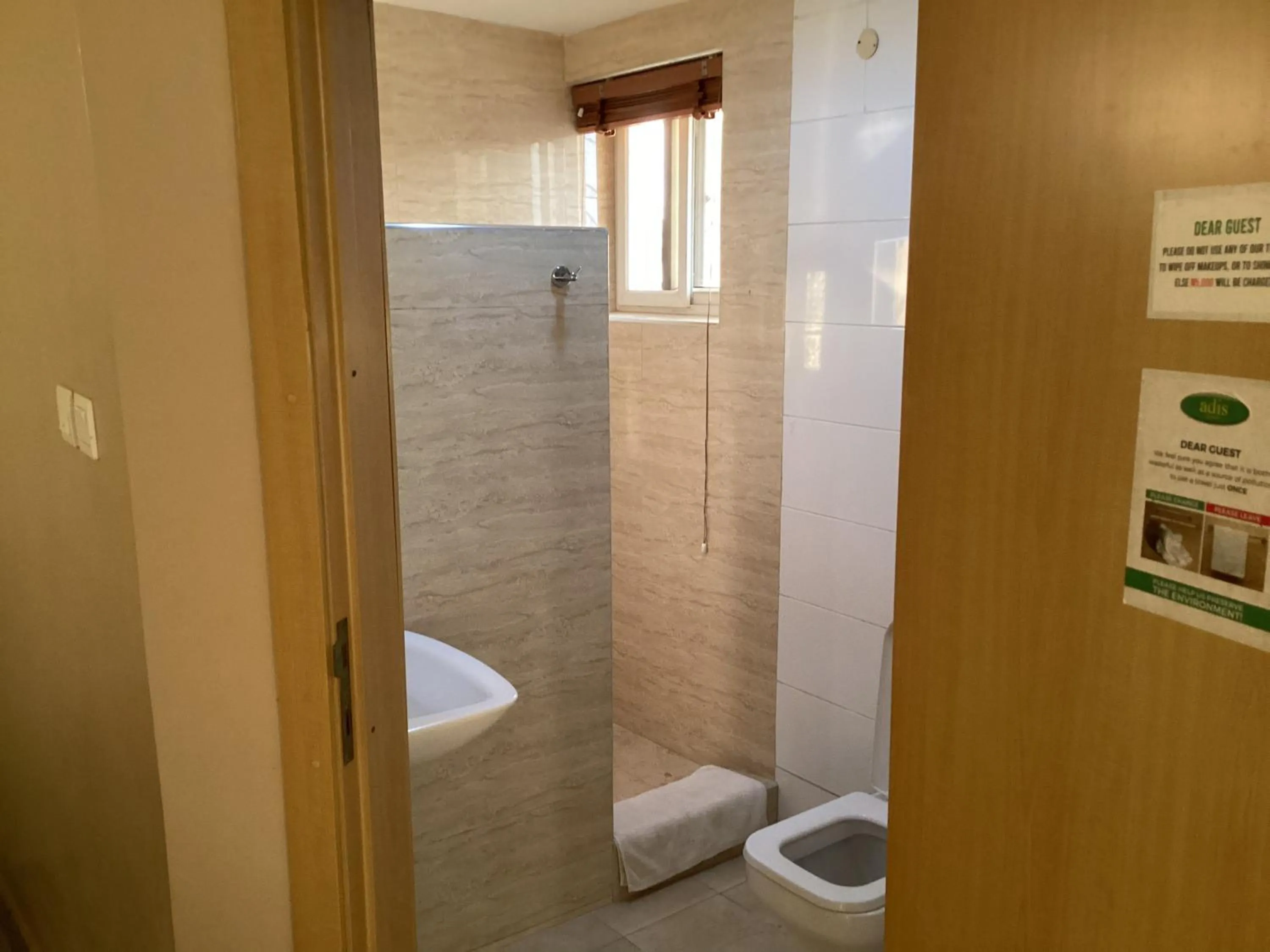 Shower in Adis Hotels Ibadan