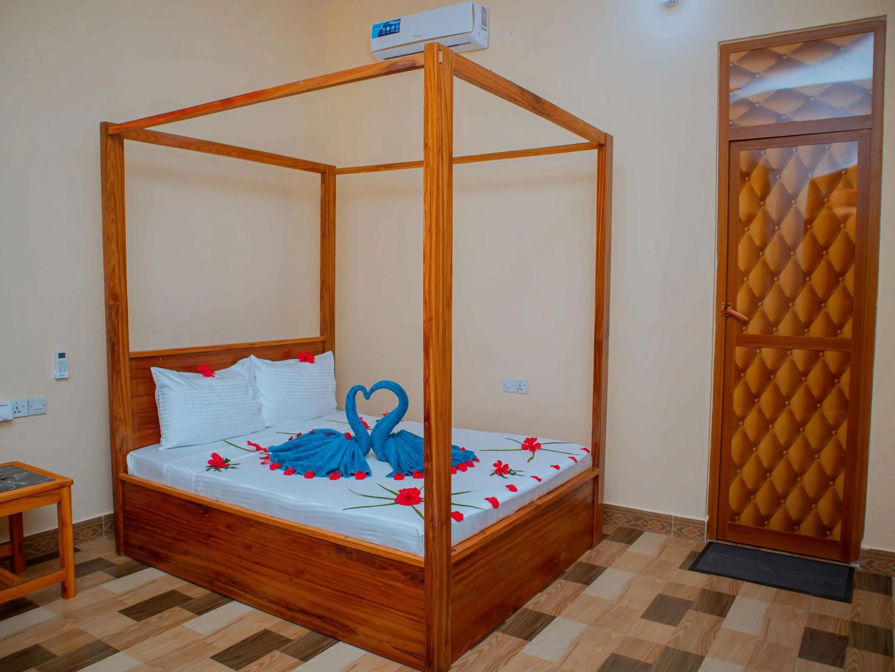 Bed in Tumaini Bungalows