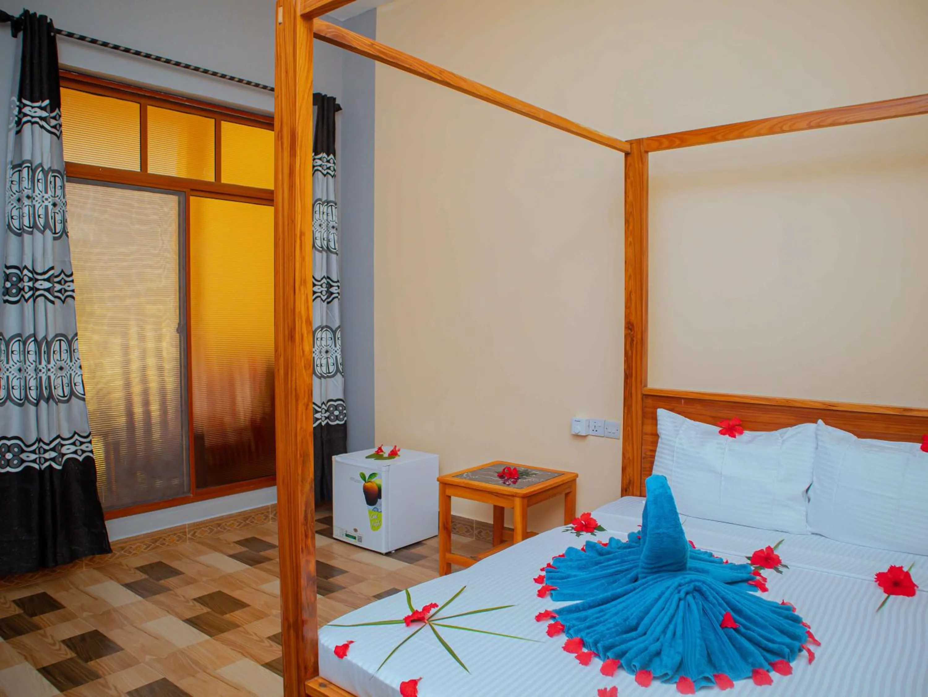 Bed in Tumaini Bungalows