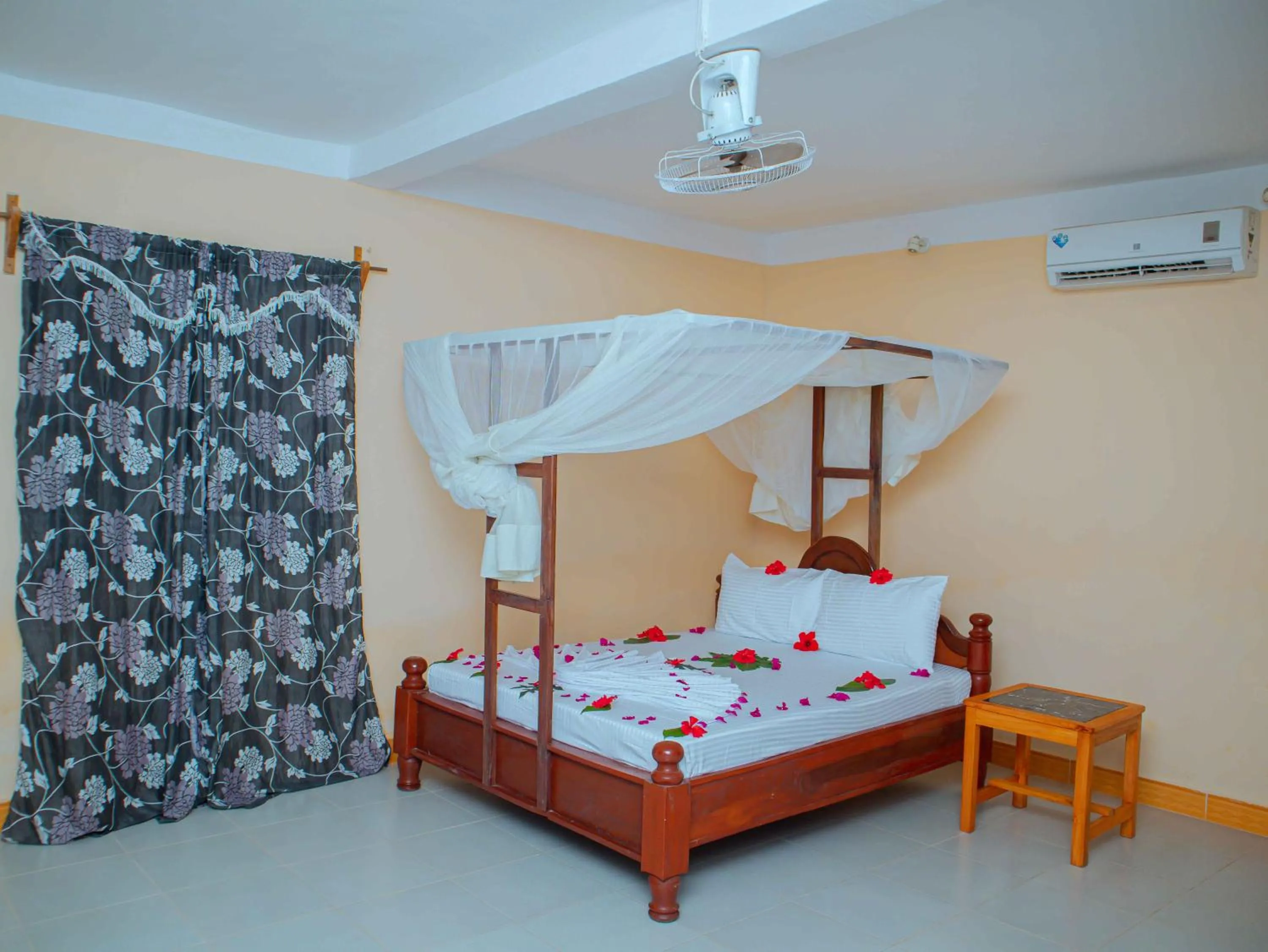 Bed in Tumaini Bungalows