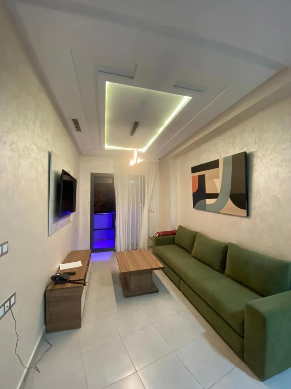 Communal lounge/ TV room in RIMAS Apparthôtel