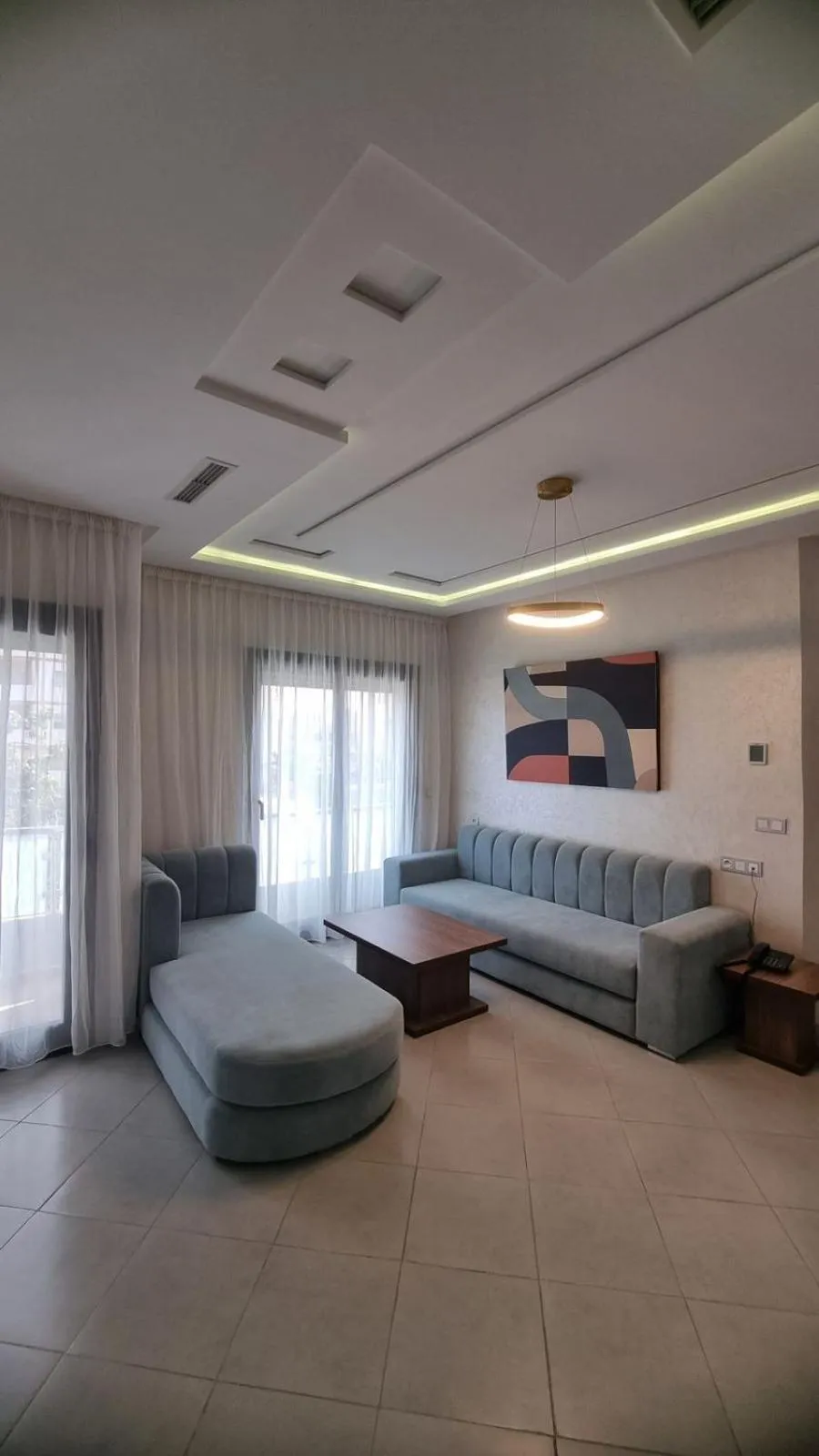 Living room, Bed in RIMAS Apparthôtel