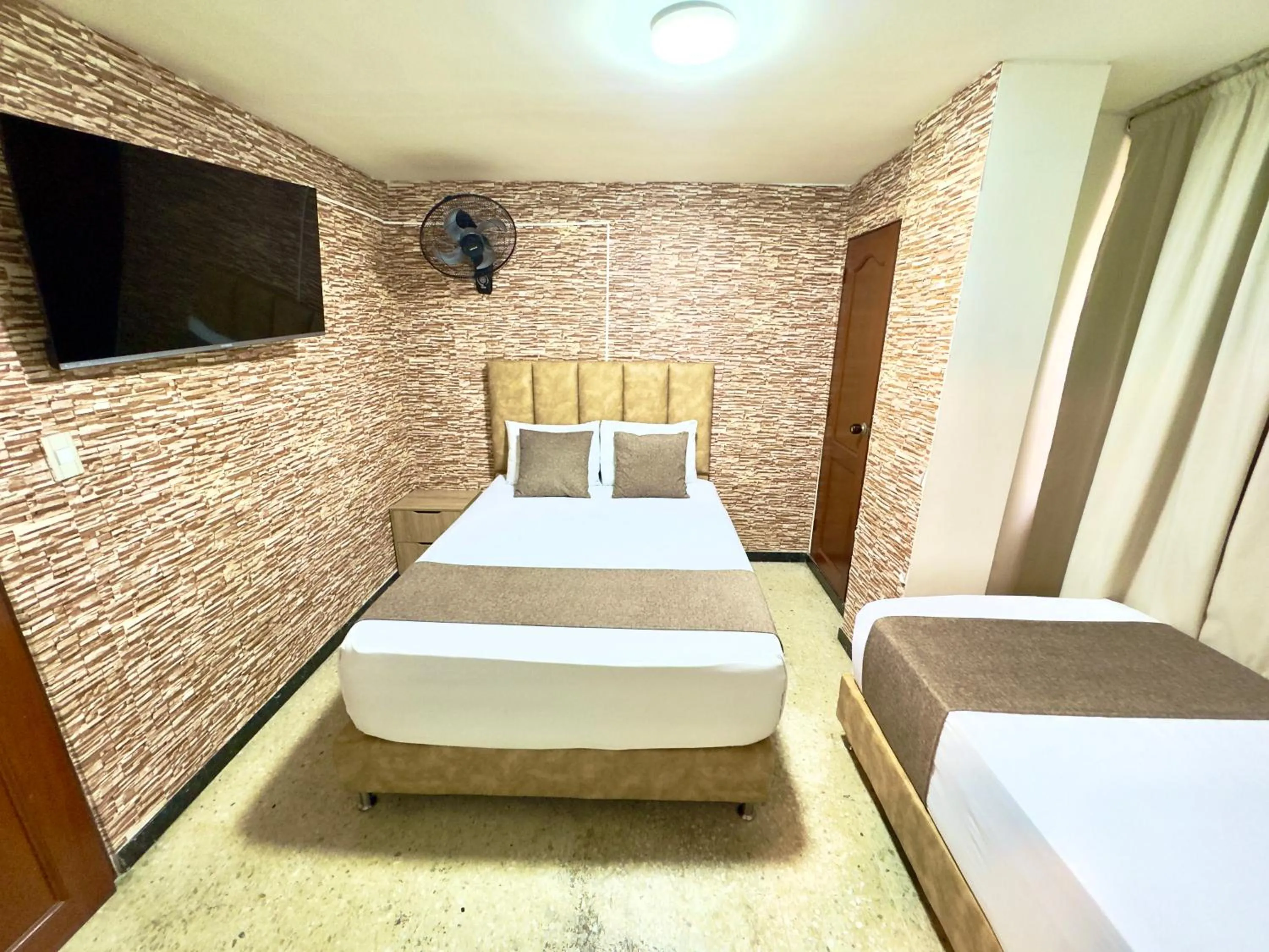 Bed in Hotel Pereira Central