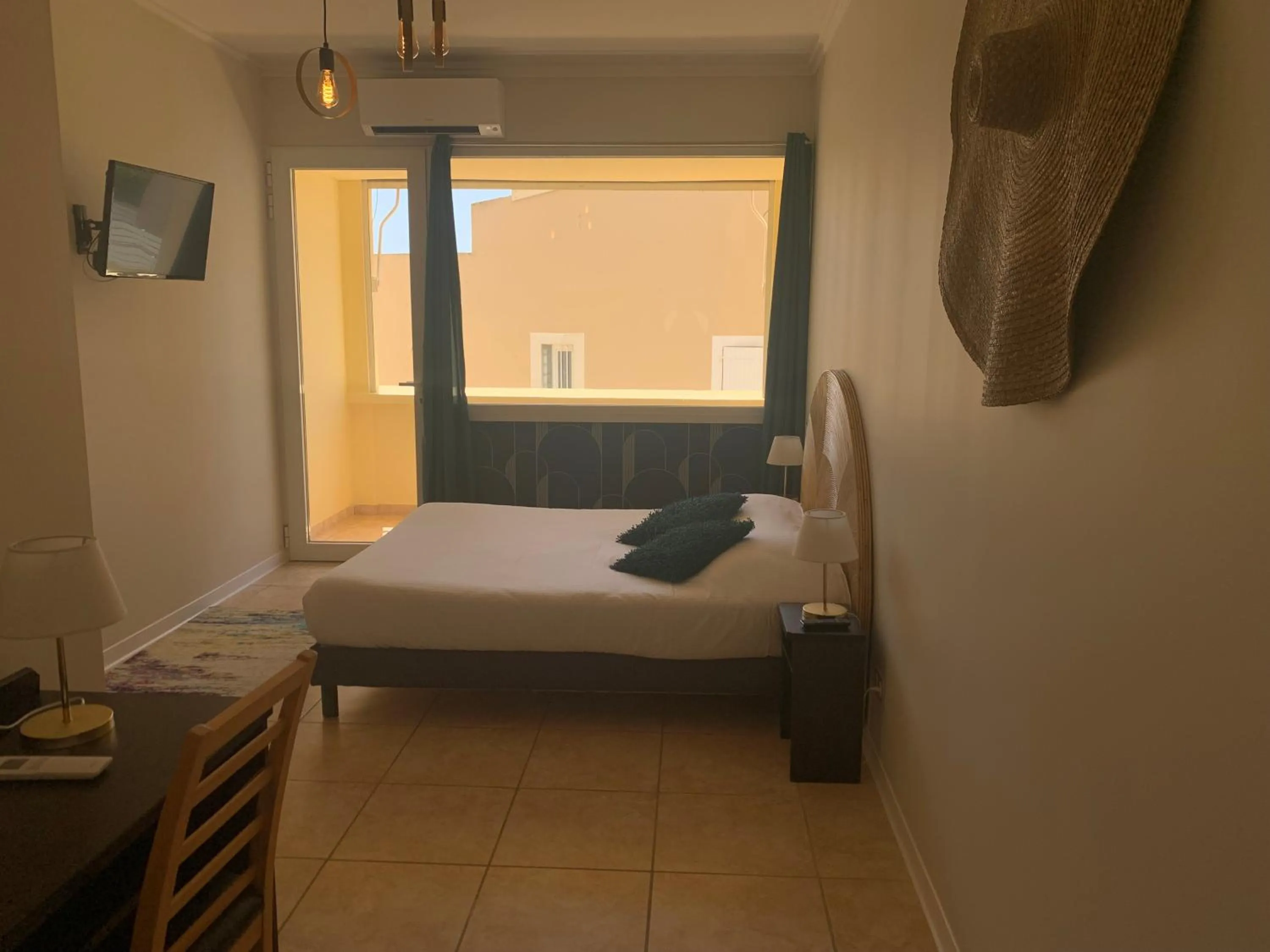 Bed in Hôtel La Grande Conque