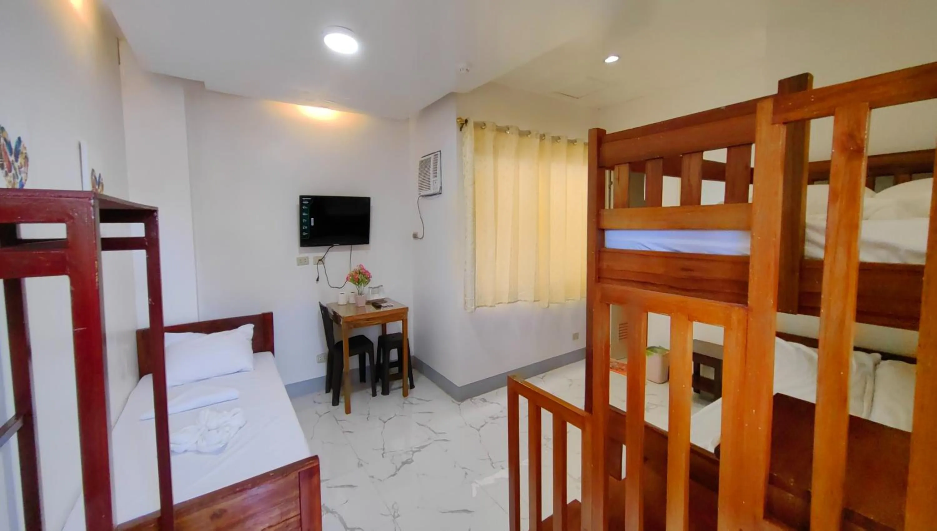 Photo of the whole room, Bed in Pring Pension House Puerto Princesa