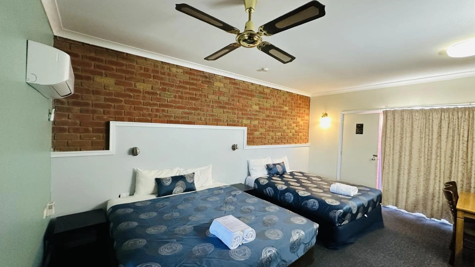 Bed in Early Australian Motor Inn