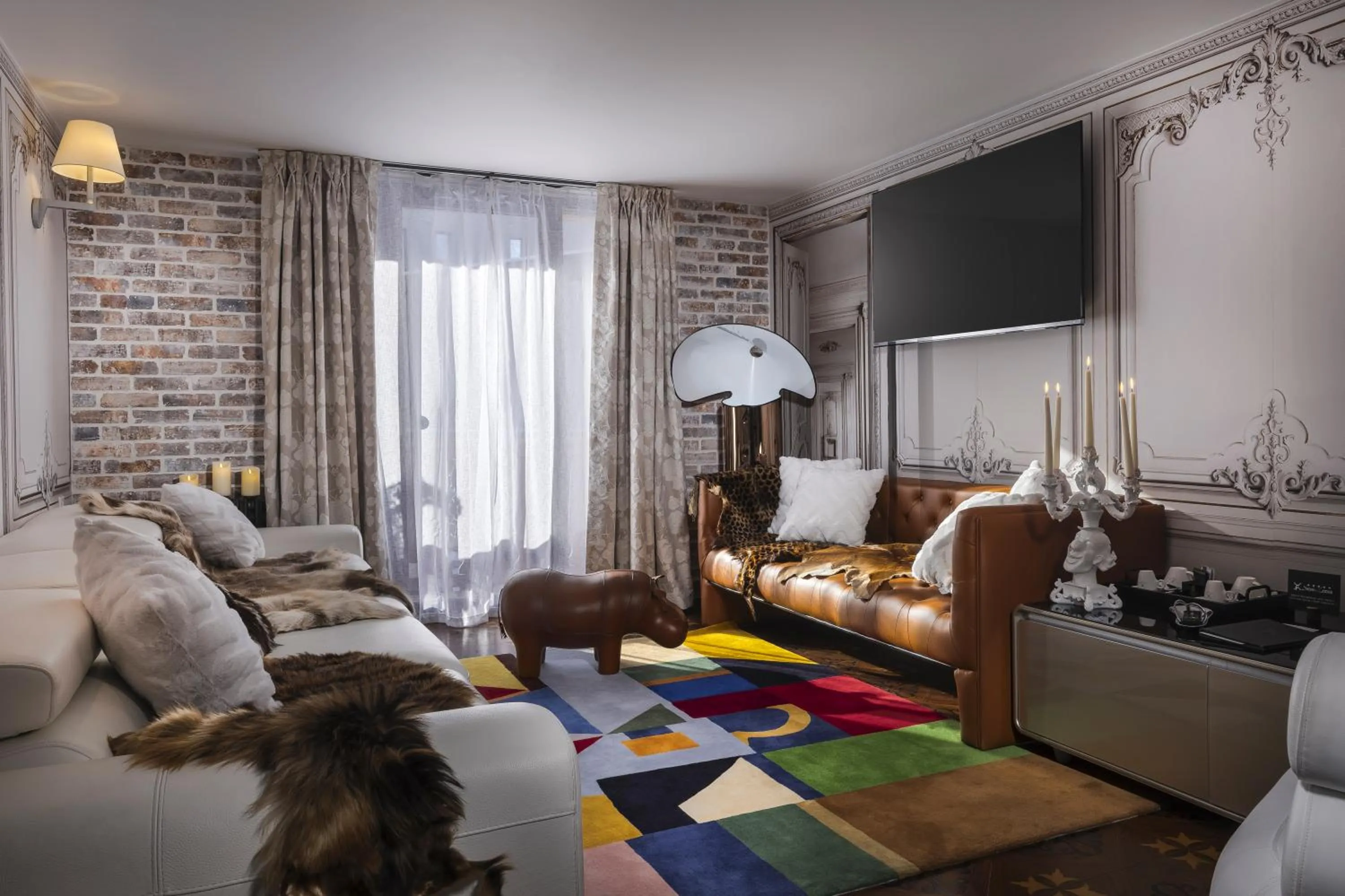 Seating area, Bed in Snow Lodge Hotel Courchevel 1850