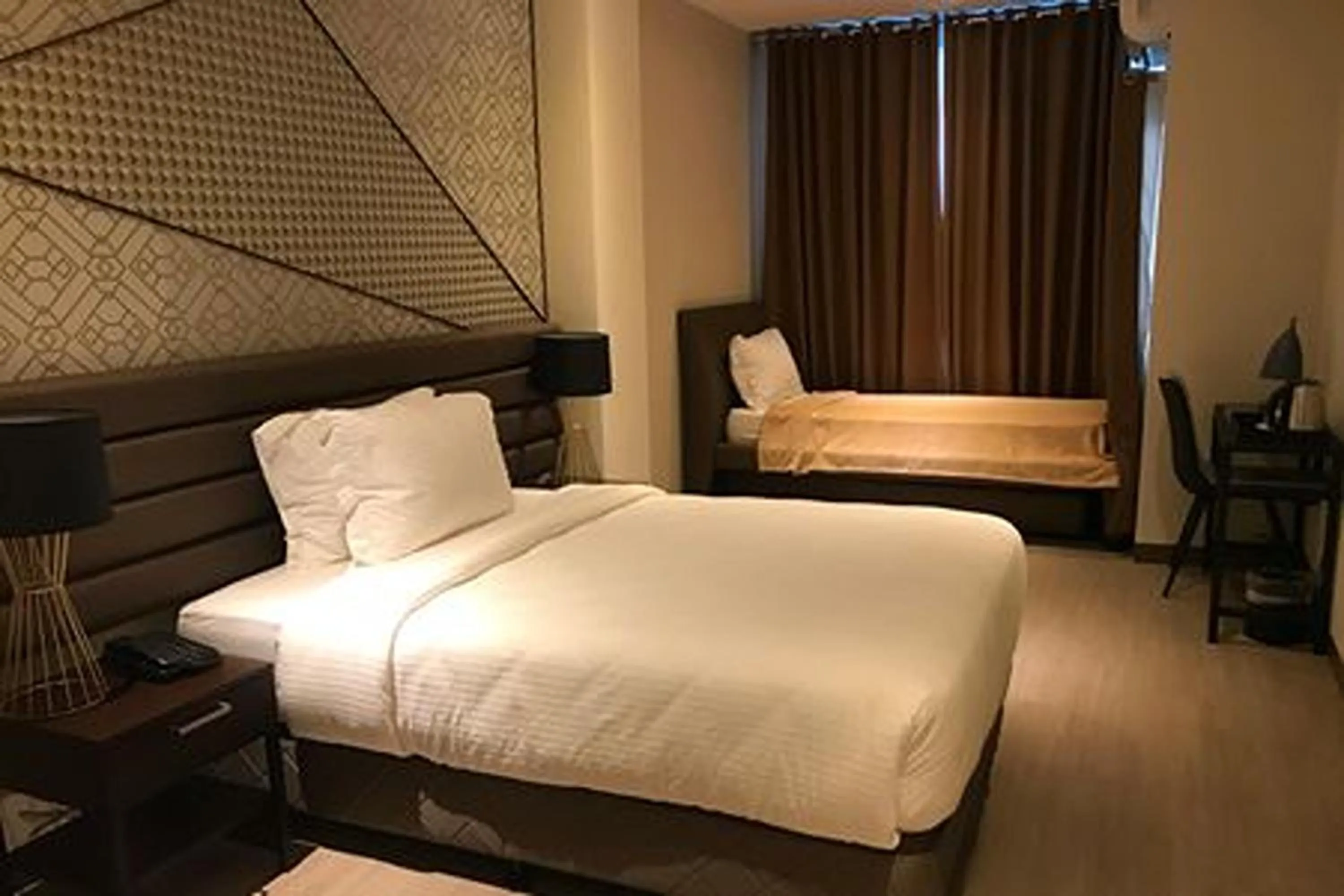 Bed in Maxx Hotel Ortigas