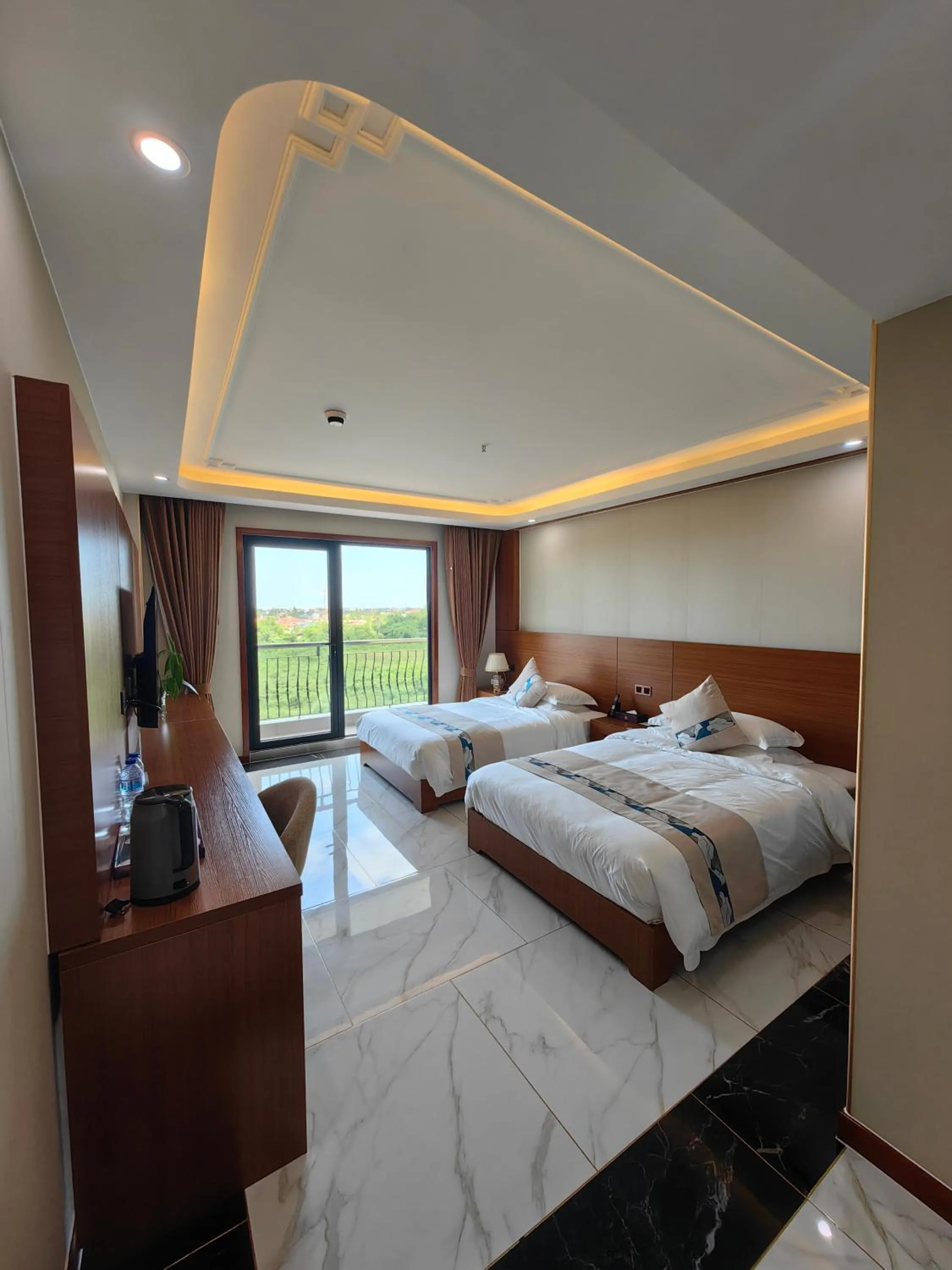 Bed in Royal International Hotel & Mall