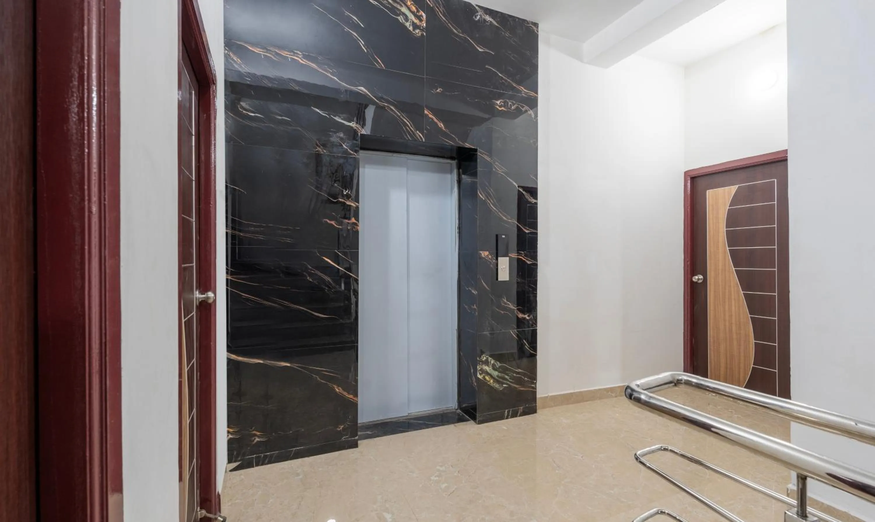 elevator in Treebo Royal Plaza, 700 Mts From Promenade Beach