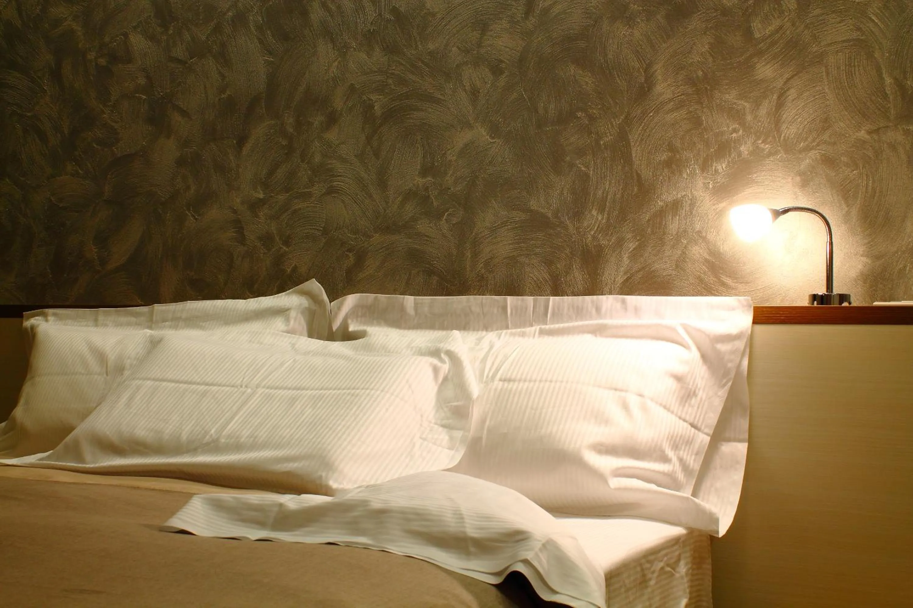 Bed in BHL Boutique Rooms Legnano