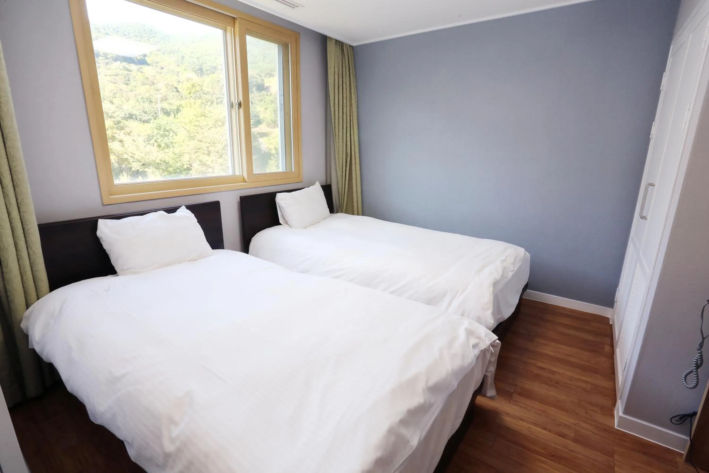 Bed in The K Jirisan Family Hotel