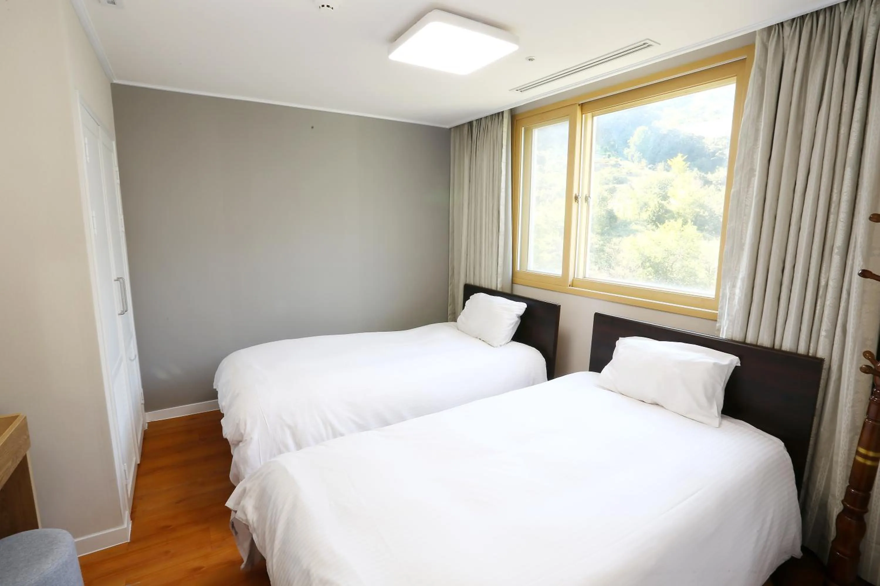 Bed in The K Jirisan Family Hotel