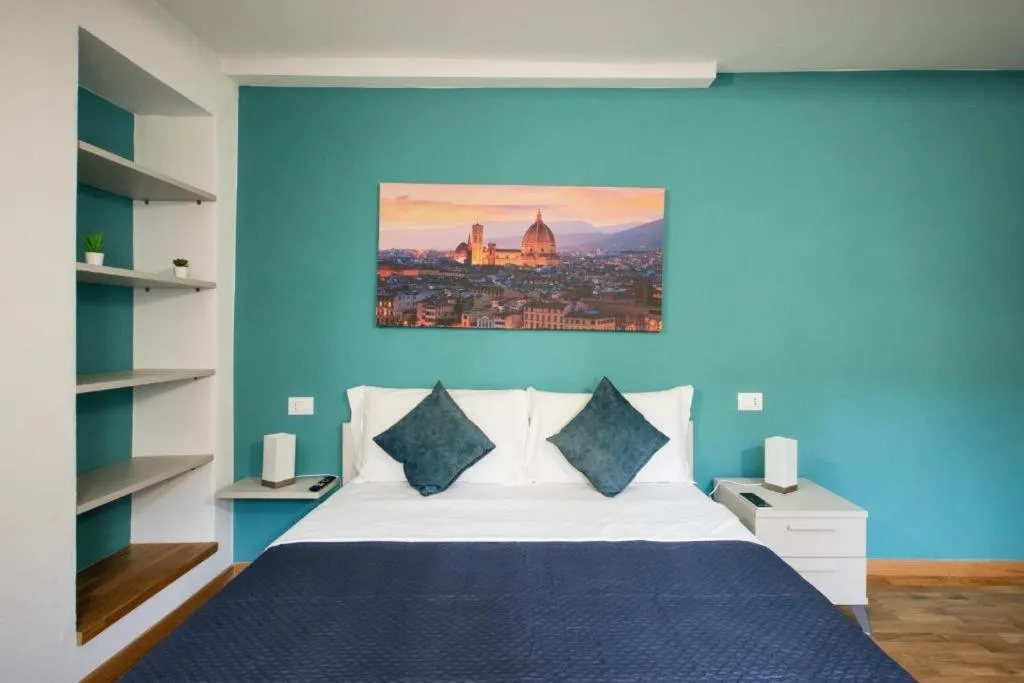 Bed in Relais Lavagnini Florence