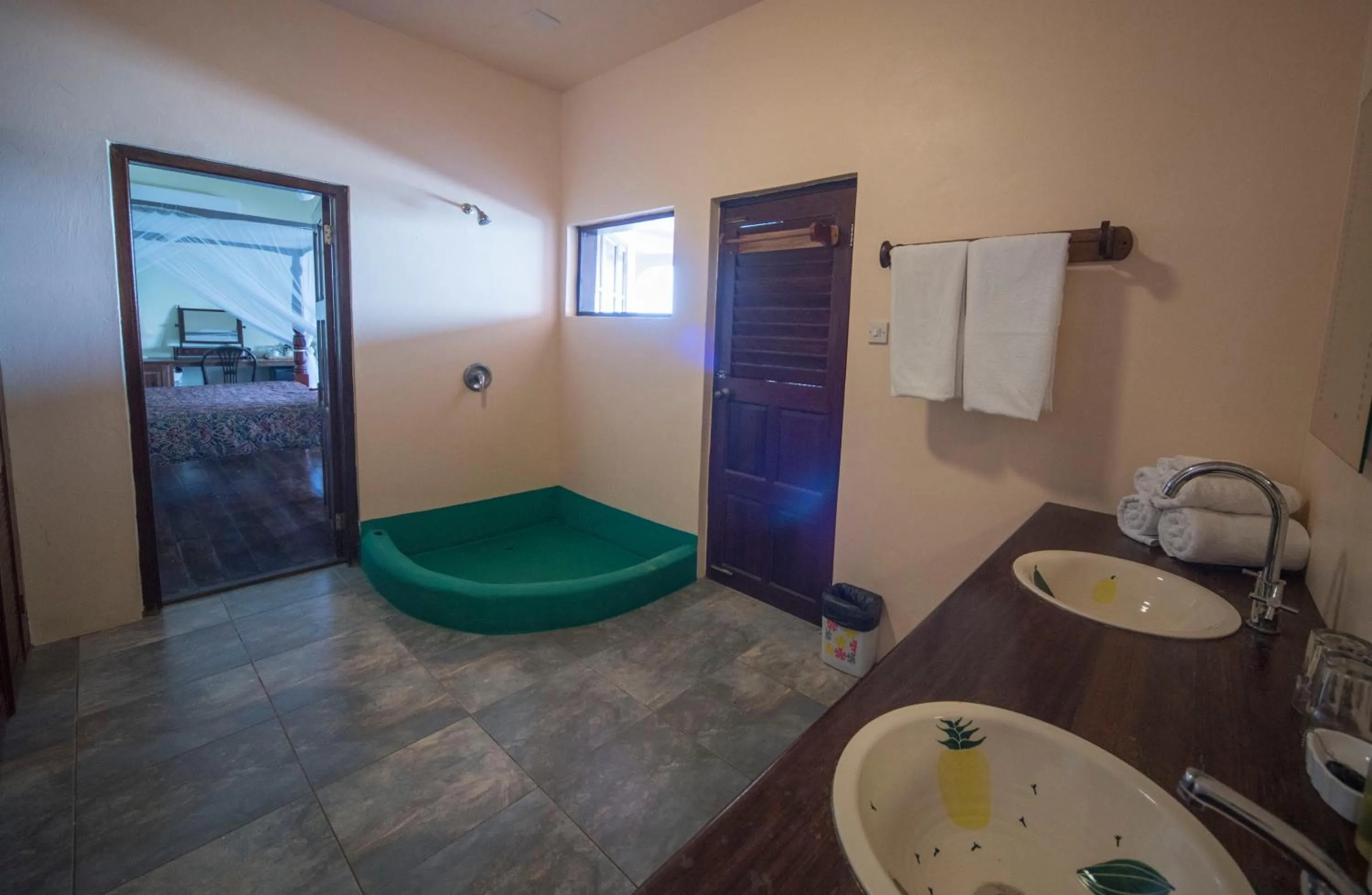 Bathroom, Bed in Petite Anse Hotel